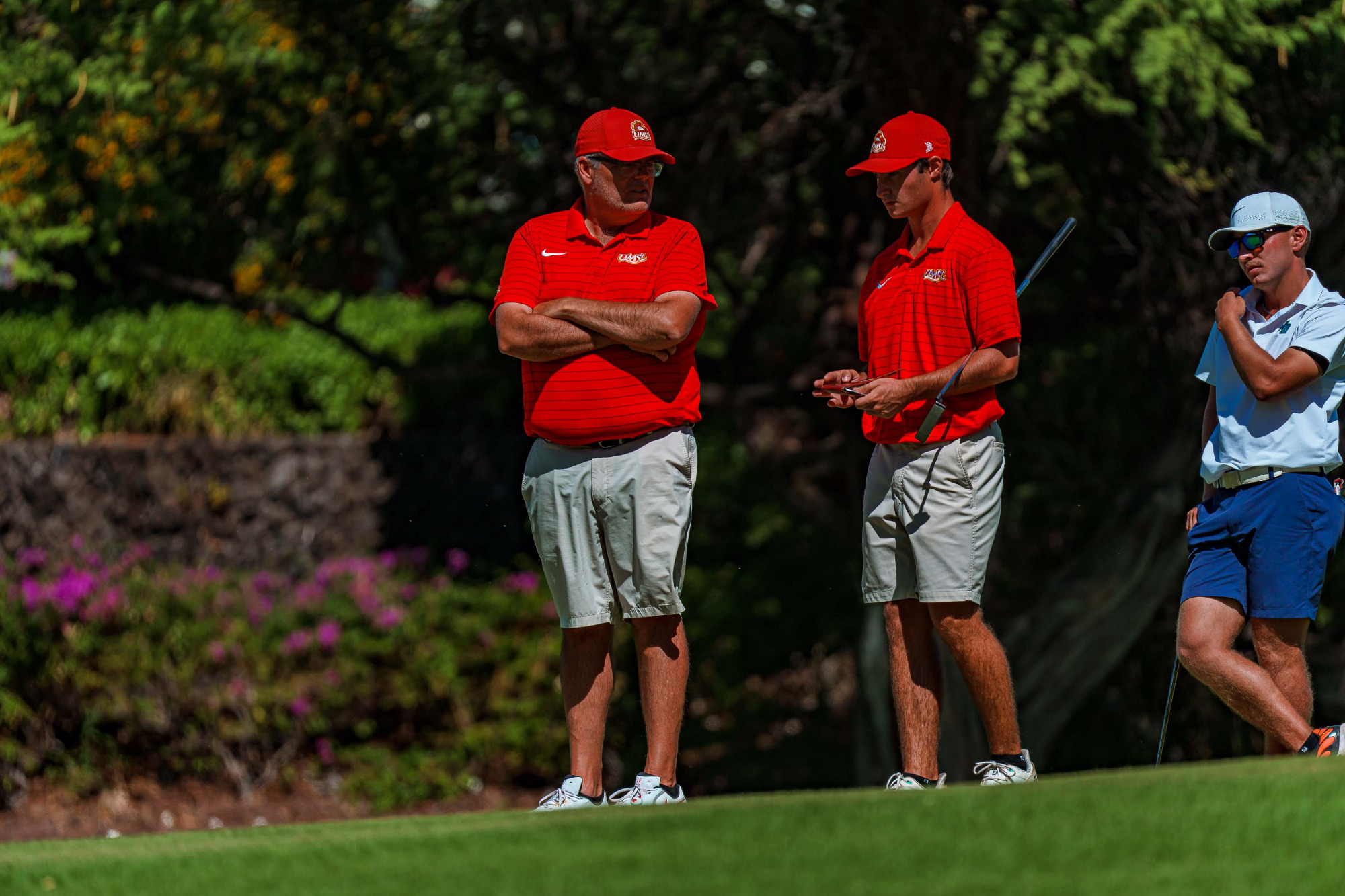 UMSL head men's golf coach Troy Halterman talks with Logan Mayo at the Dennis Rose Intercollegiate