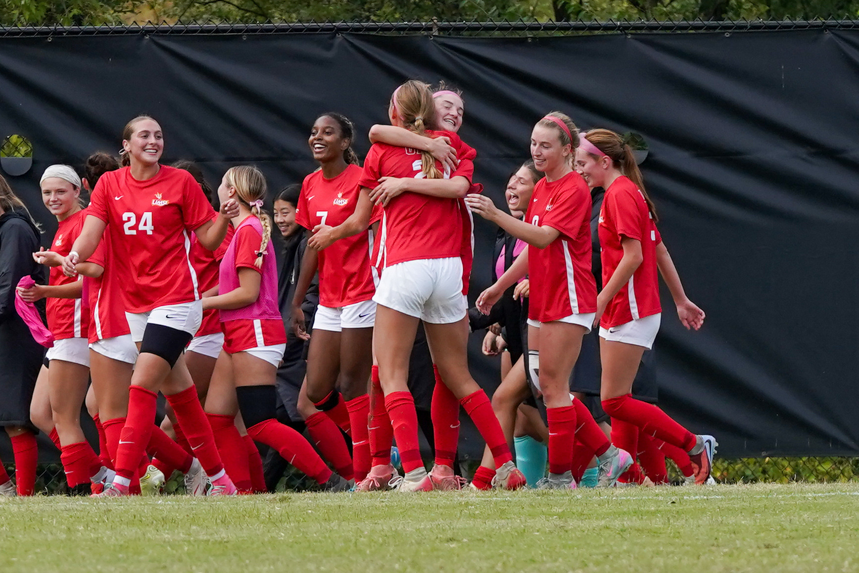 UMSL women's soccer players celebrate a goal scored