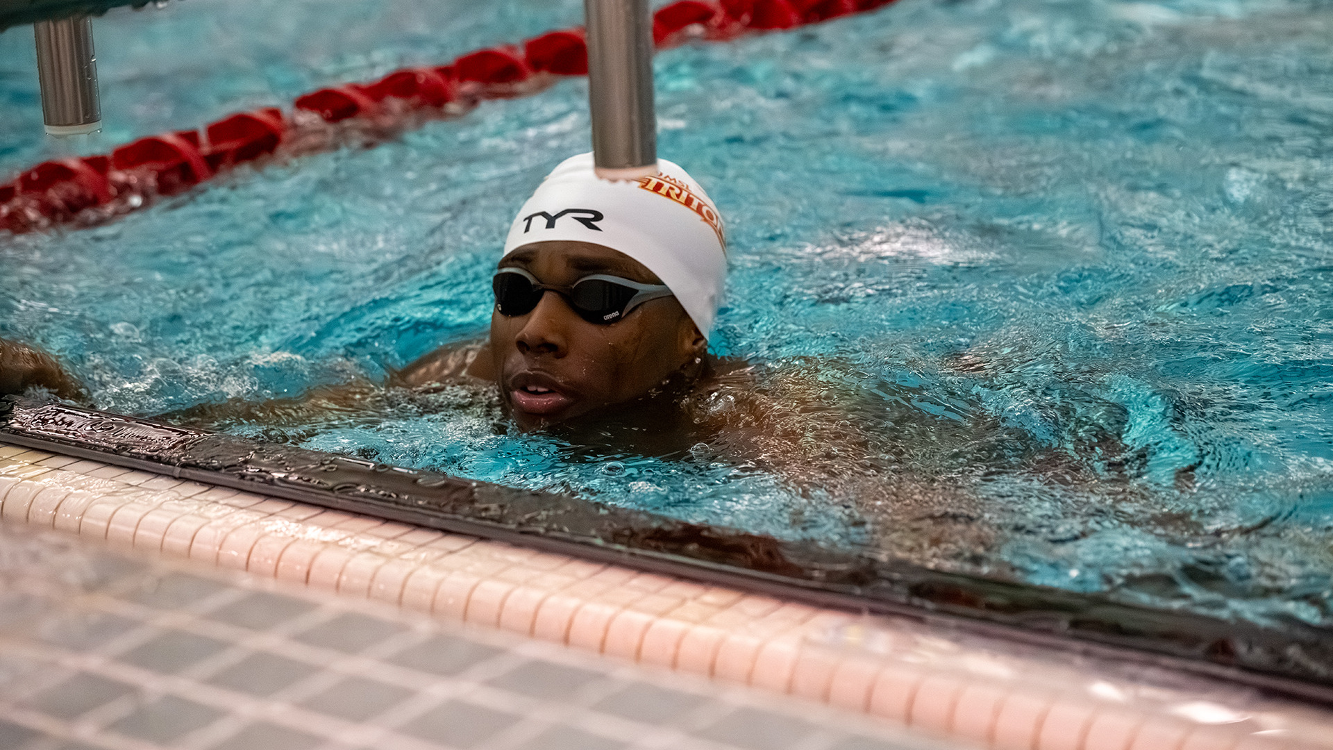 Lathan Parks finishes swimming an event