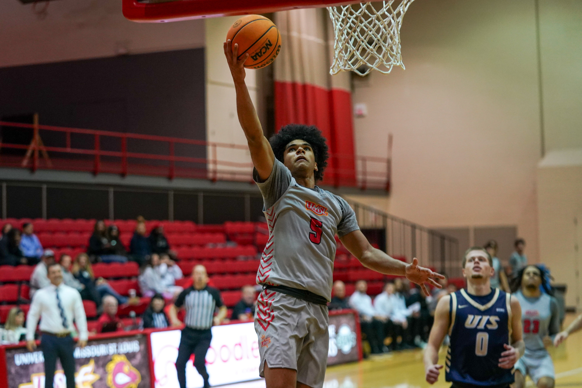 Taye Moore drives to the hoop for two points against Illinois Springfield