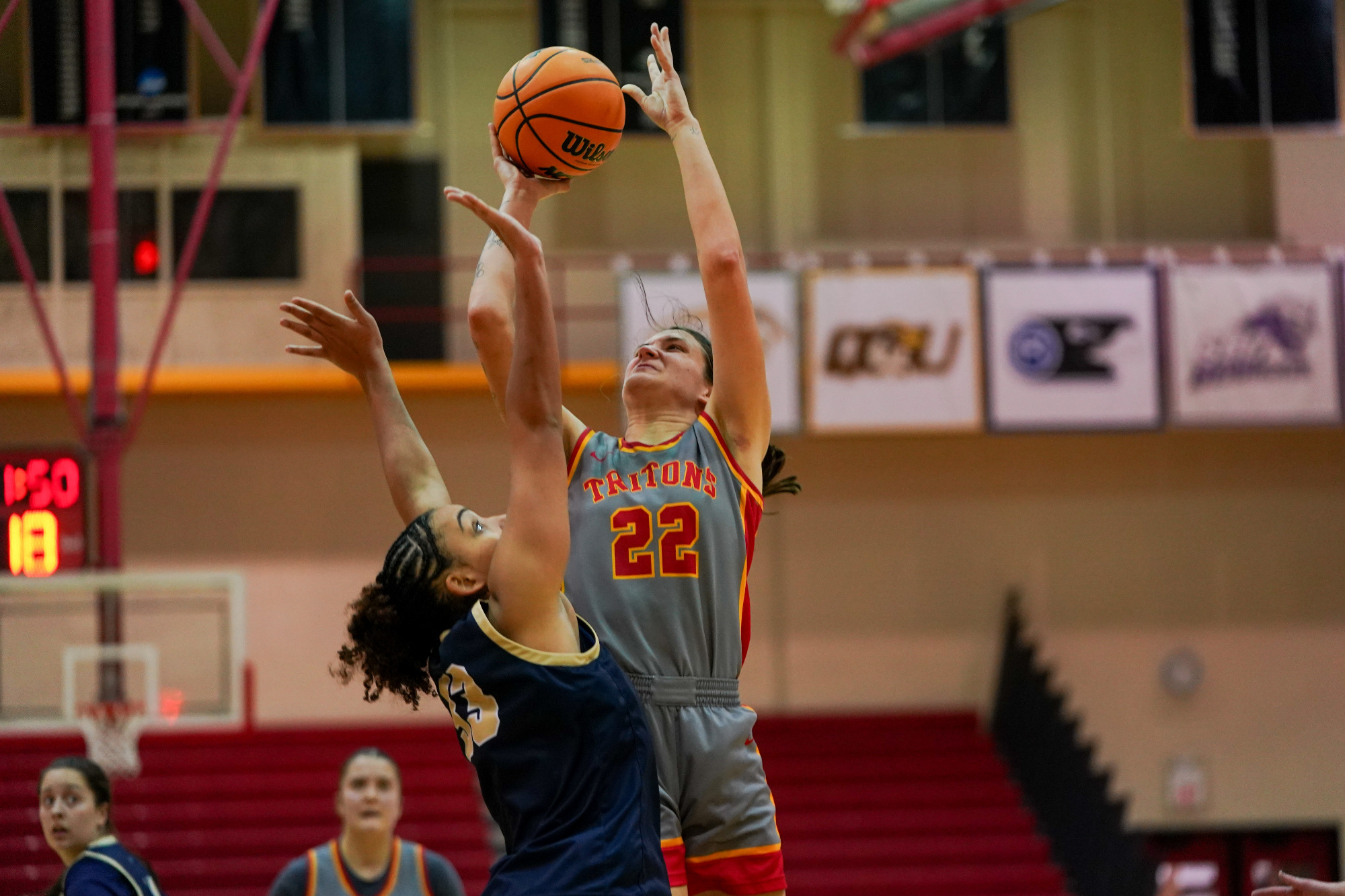 Mara Rieder attempts a jump shot over an Illinois Springfield defender