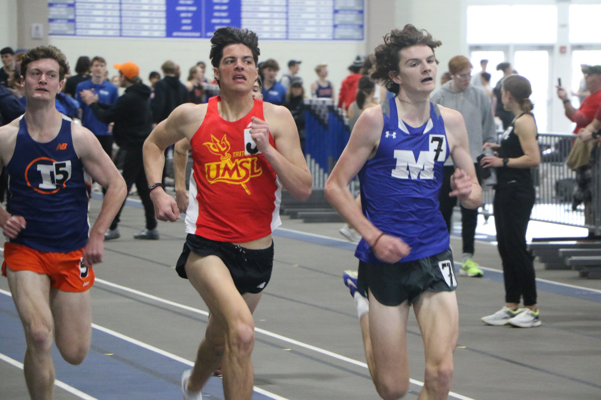Caleb Leach runs the mile at the IC Snowbird Invite