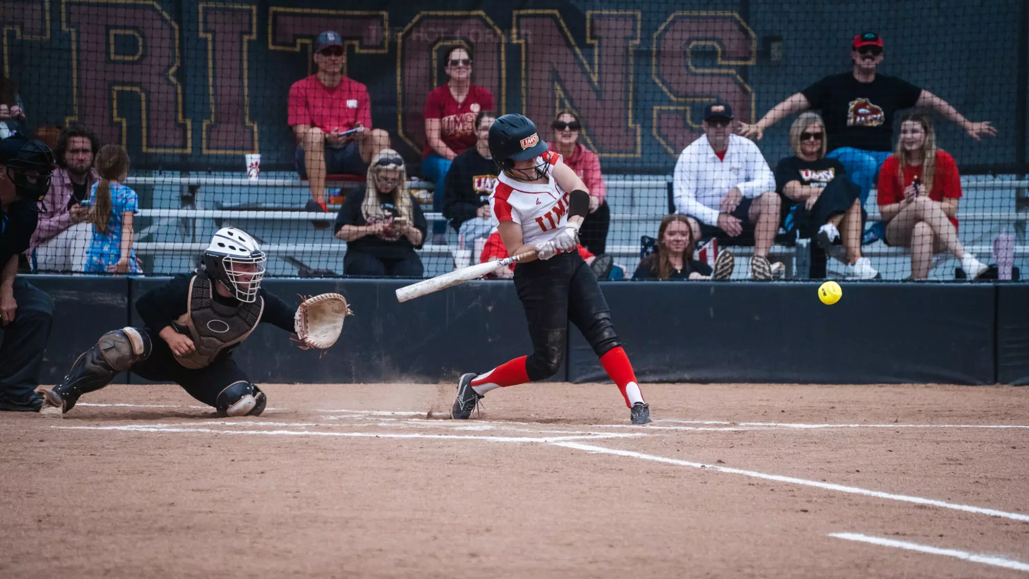 Gwyn Miller swings at a pitch