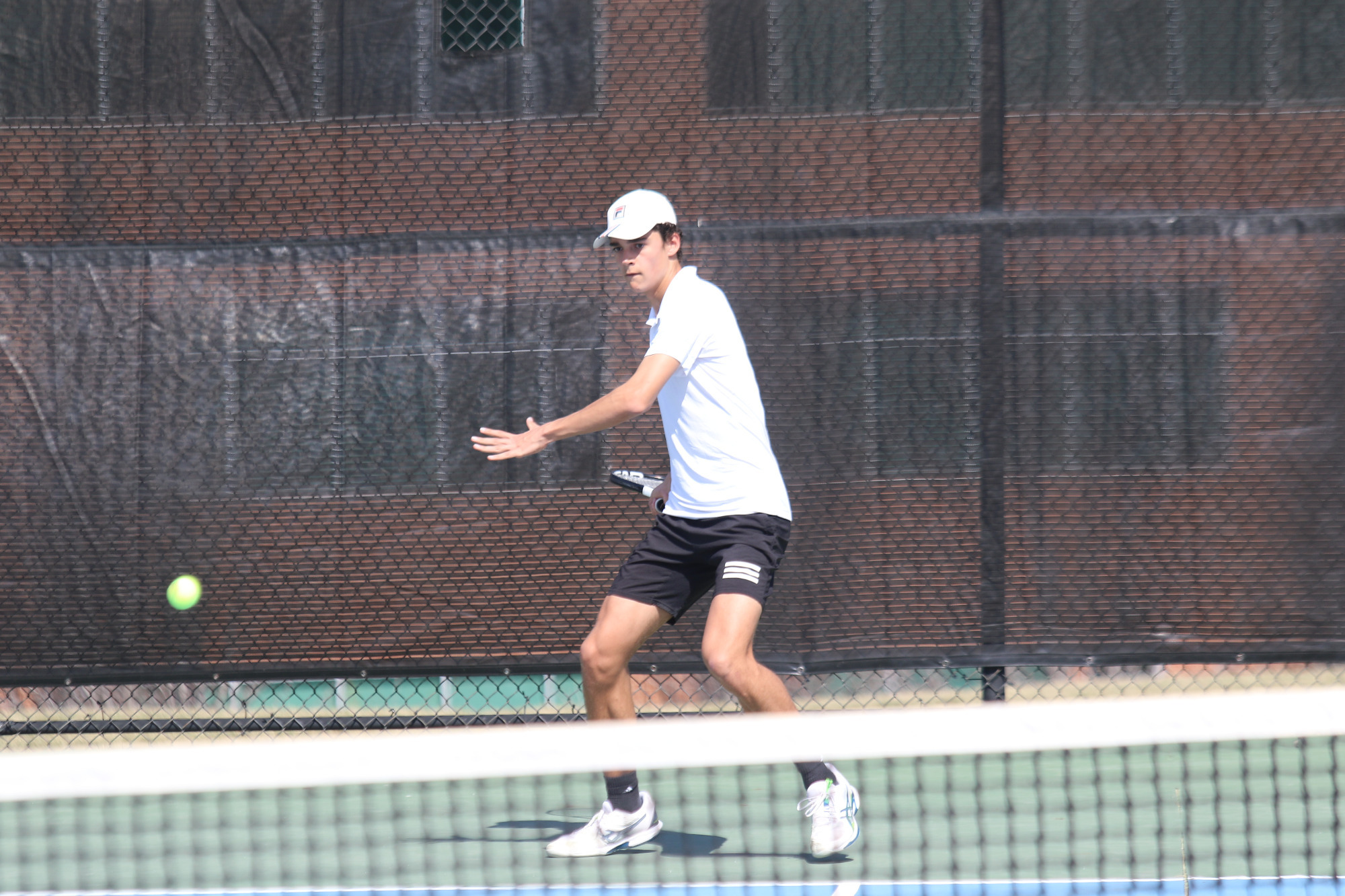 Henry Roberts hits a fore-hand shot