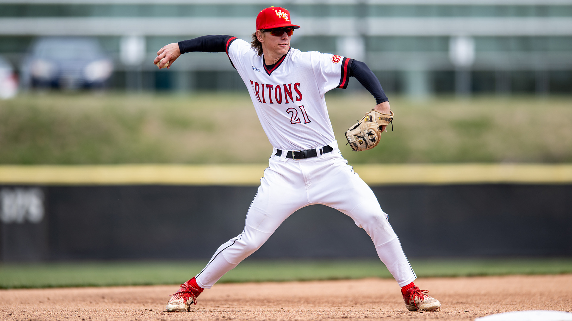 Cade Grevengoed throws to first