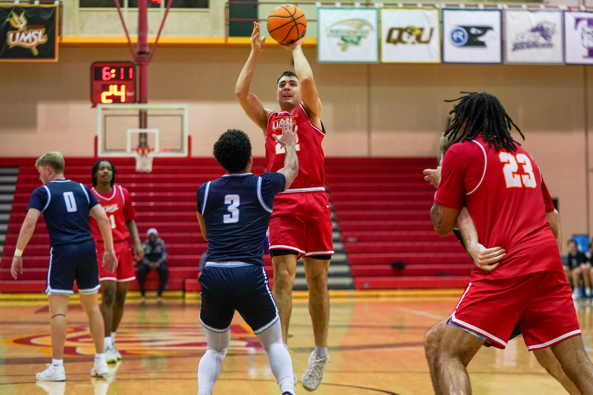 Colby Dolphin shoots a jump shot over an Upper Iowa defender in a men's basketball game on January 10, 2026