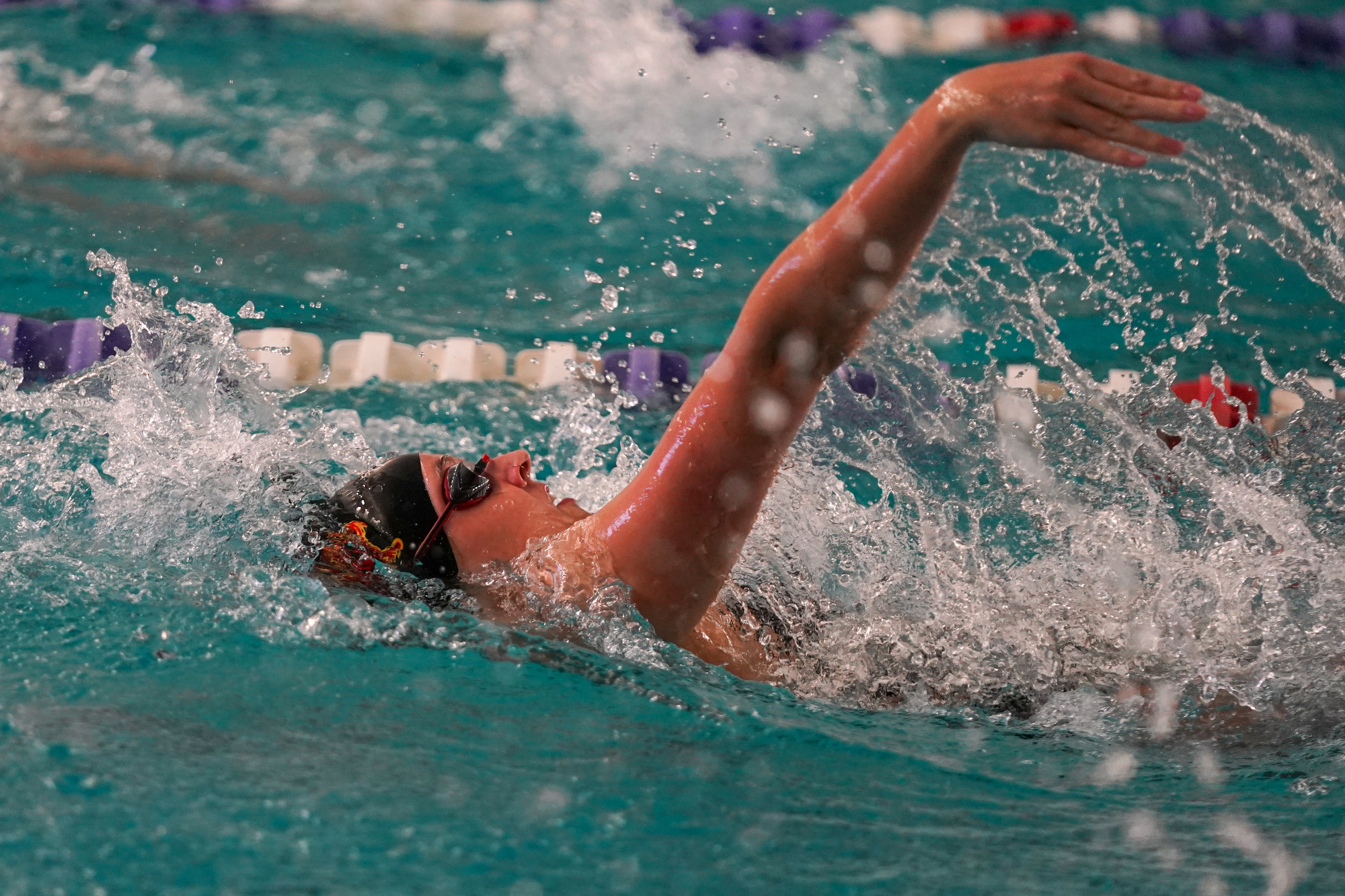 Madison Bottorff swims the back stroke