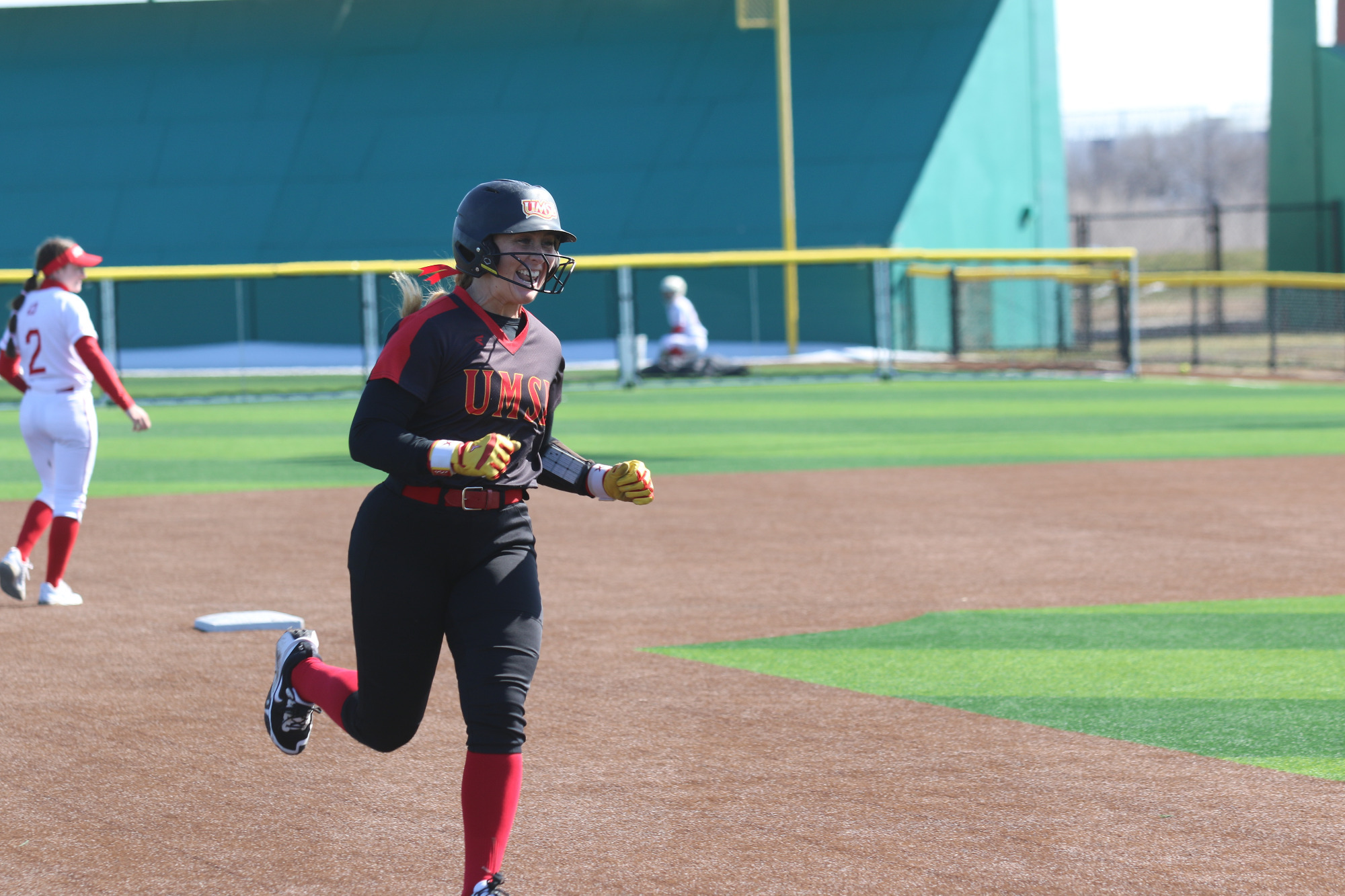 Simia Spahiev circles the bases after hitting a three-run home run