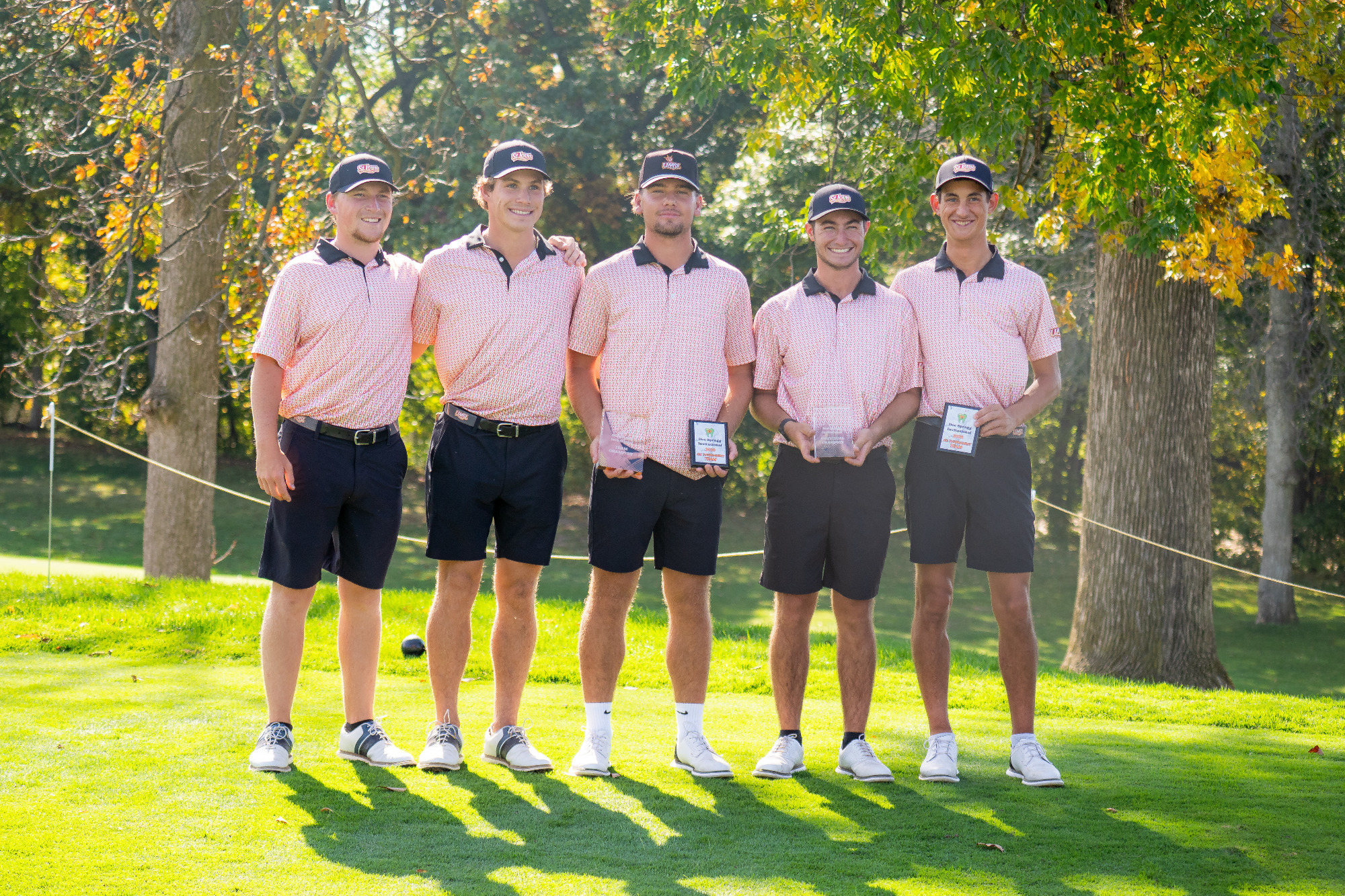 University of Missouri-St. Louis men's golf team members (from left): Benjamin Berger, Campbell Cox, Ludvig Granlund, Logan Mayo and Trigg Lindahl pose with their team trophy and individual awards during the awards ceremony at the Doc Spragg Invitational