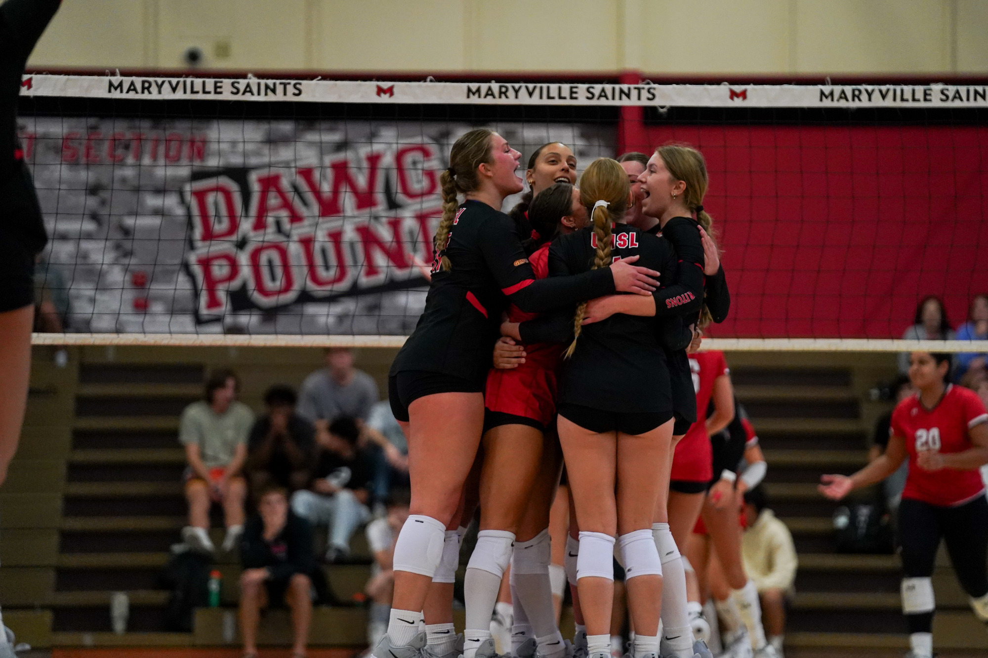 The Tritons celebrate in their volleyball match at Maryville
