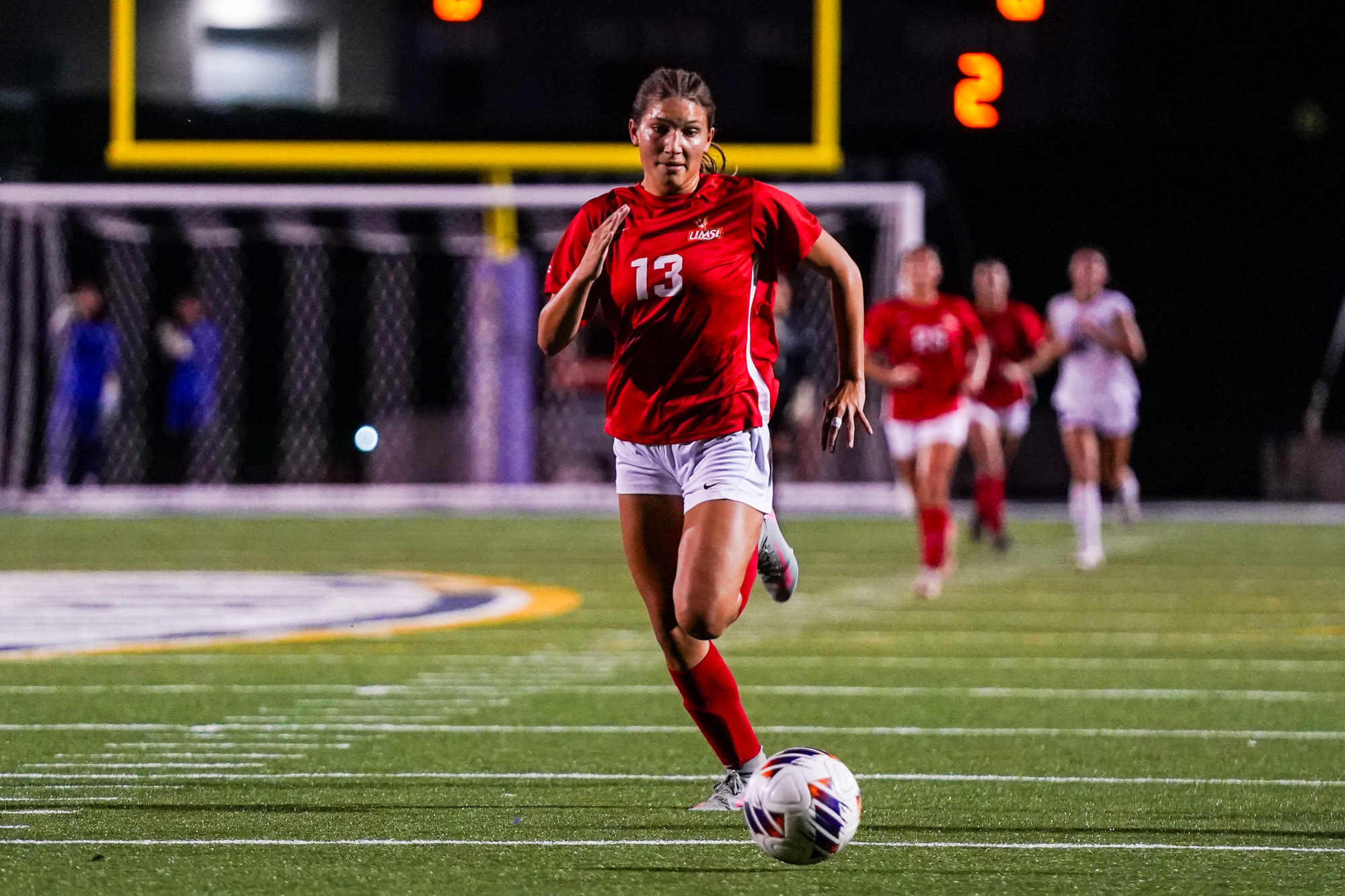 Ella Anselm chases down a loose ball in a women's soccer match at McKendree