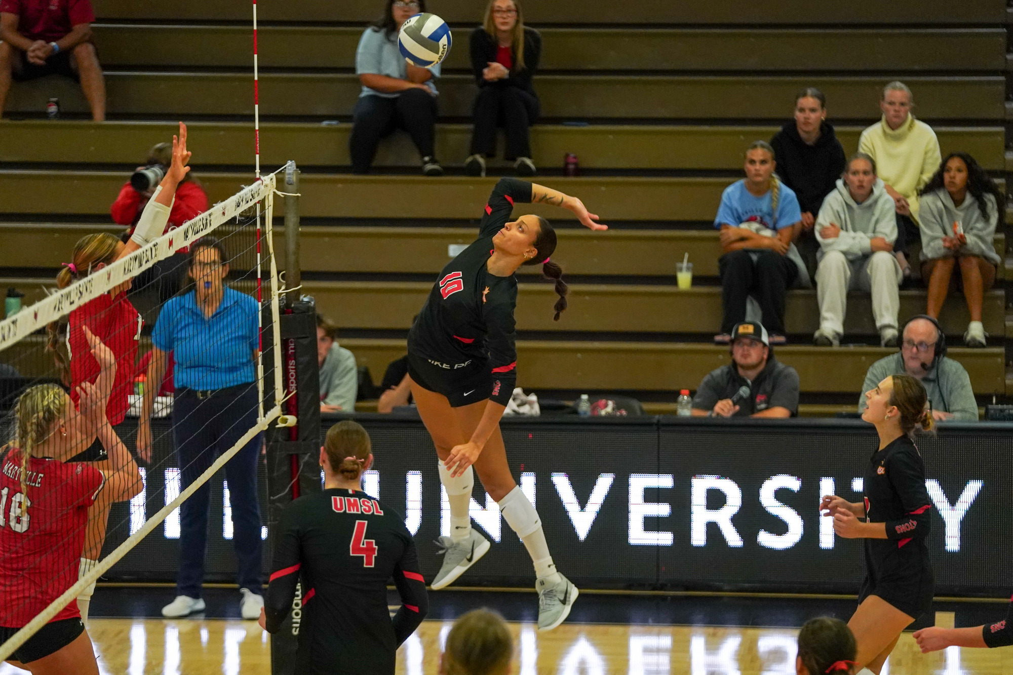 Brooklyn Young goes up for an attack in a volleyball match at Maryville