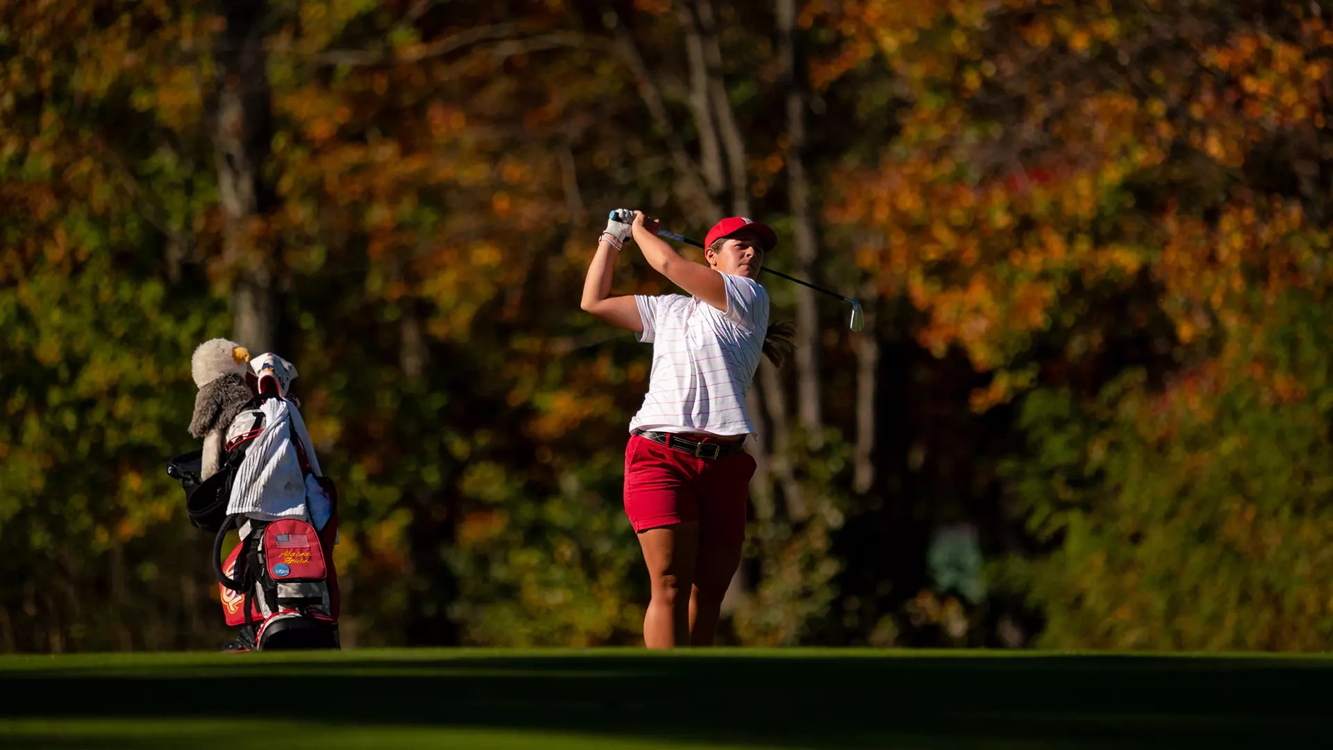 Alaina Ervin watches her drive after teeing off at the Intercollegiate at Nemacolin.
