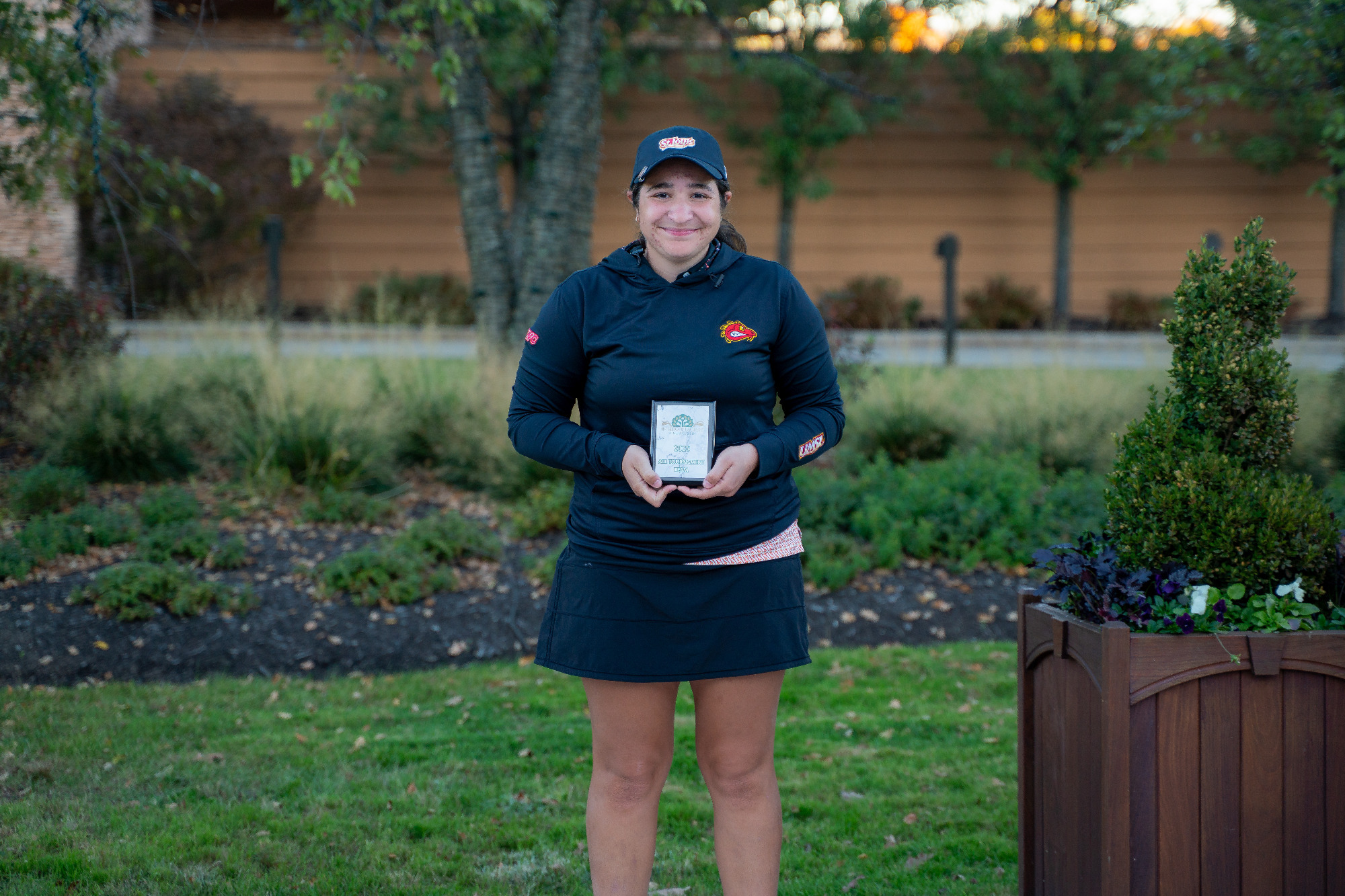 Mayan Covarrubias holds her Intercollegiate at Nemacolin All-Tournament team plaque