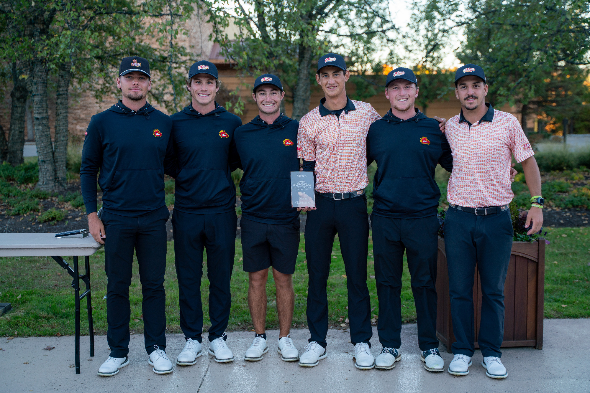 UMSL Men's Golf Team poses for a picture with its team trophy after winning the Intercollegiate at Nemacolin on Wednesday (Oct. 21).