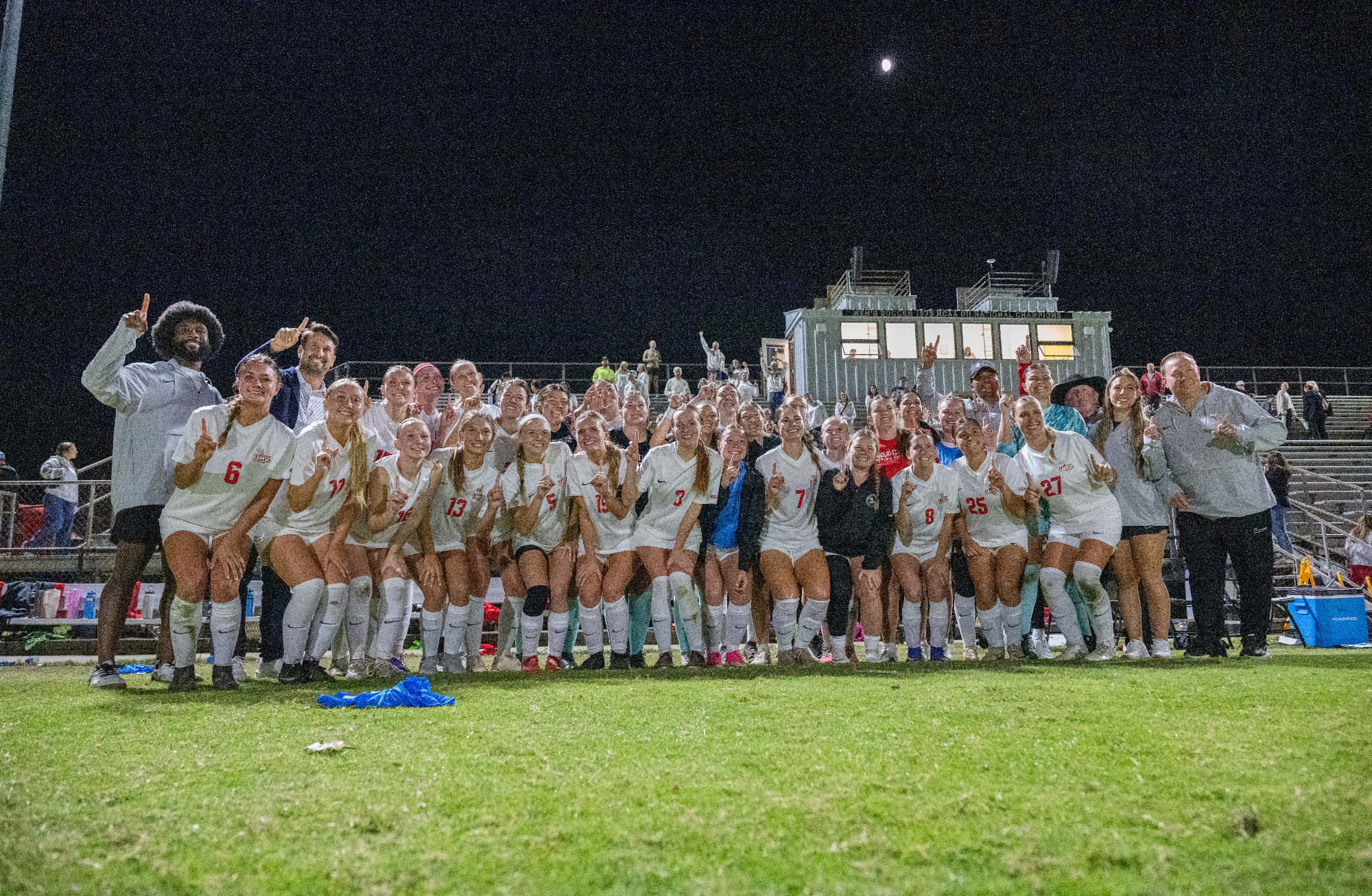UMSL Women's Soccer Team celebrate with a team photo after clinching the Great Lakes Valley Conference regular season title