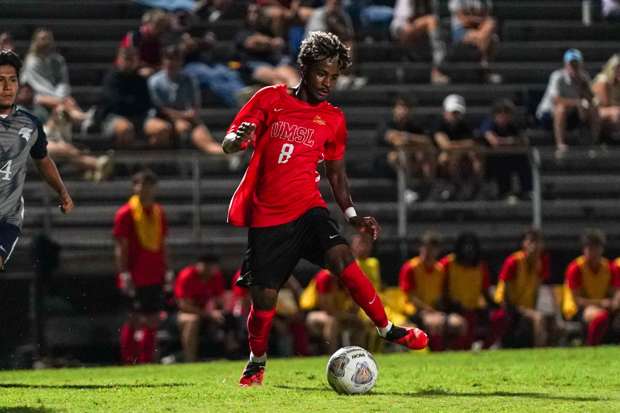 Gunther Jean-Louis dribbles the soccer ball in a men's soccer match against Missouri Baptist.
