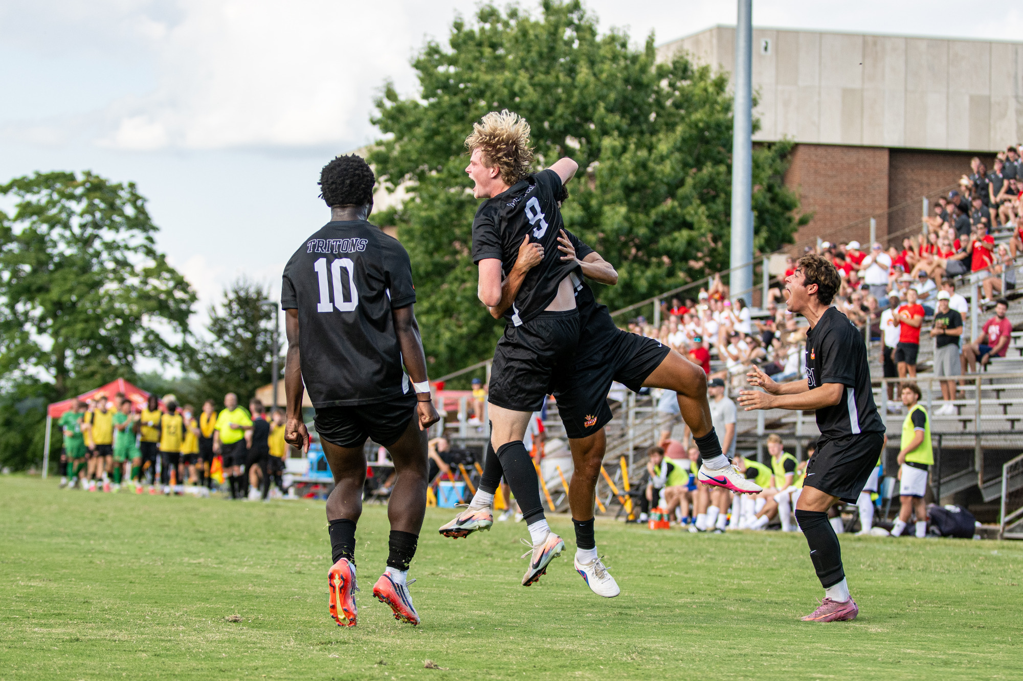 Brady Freeman celebrates his goal against Kentucky Wesleyan with Melo Mensah (#10) and Benjamin Ocampo (#7)