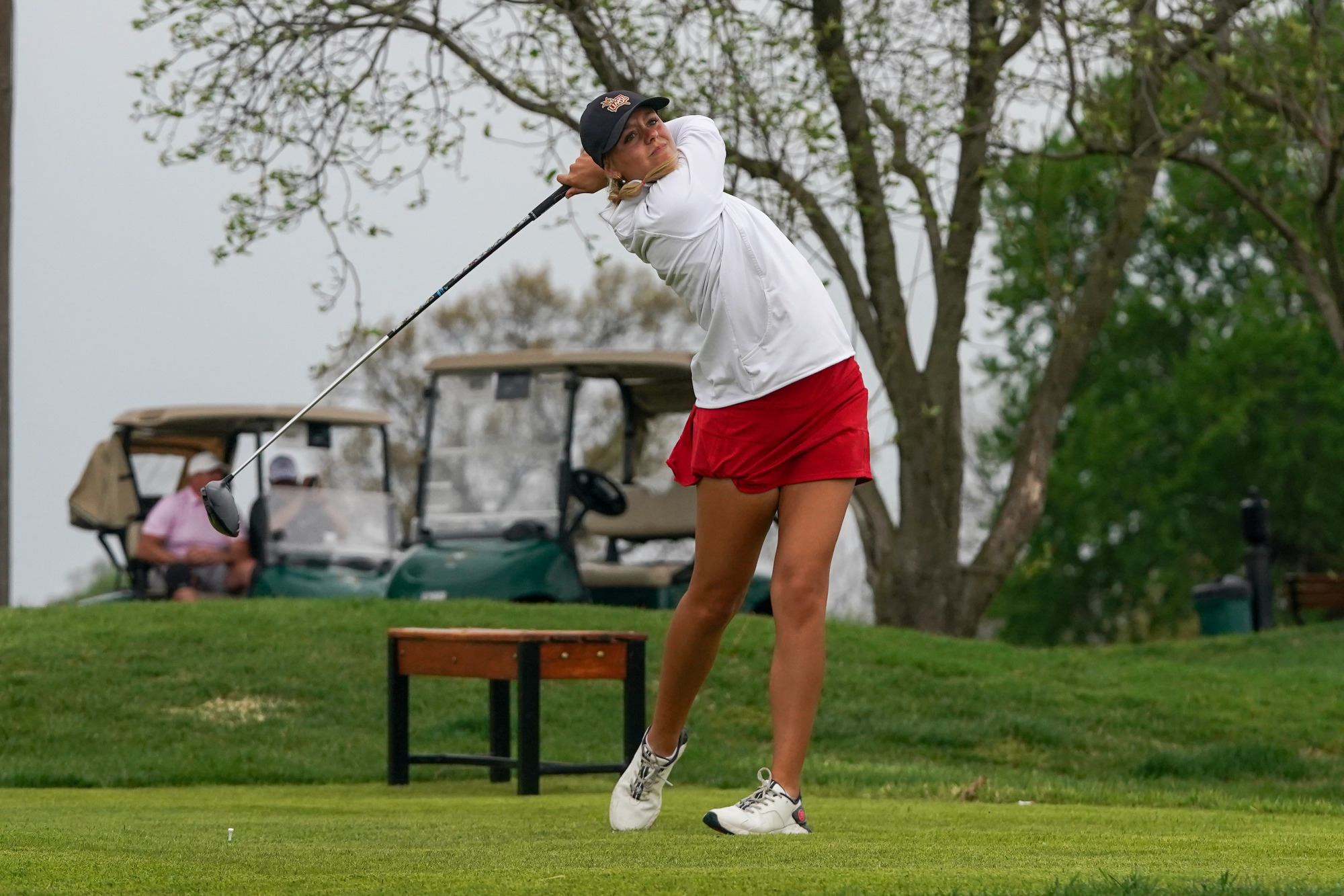Hillary Currier follows through after hitting driver off tee in the UMSL Spring Invitational