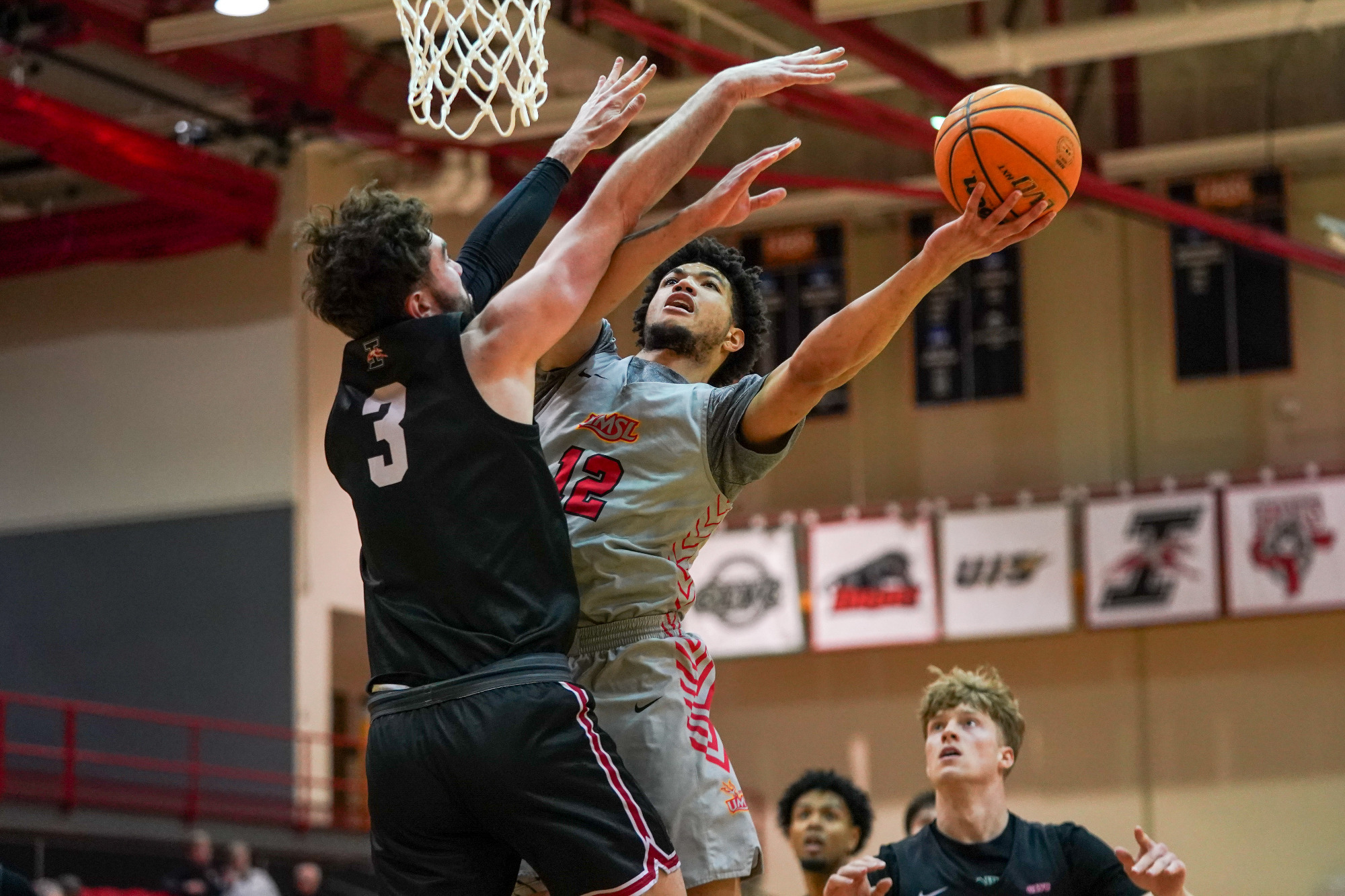 Vincent Davis III attempts a shot against a UIndy defender in a game on February 5, 2026