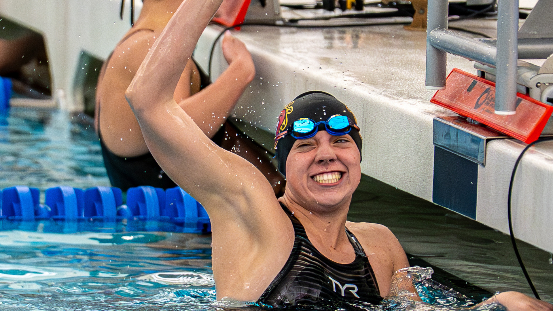 Justice Beard celebrates after winning the 200-yard freestyle at the Great Lakes Valley Conference championship meet.