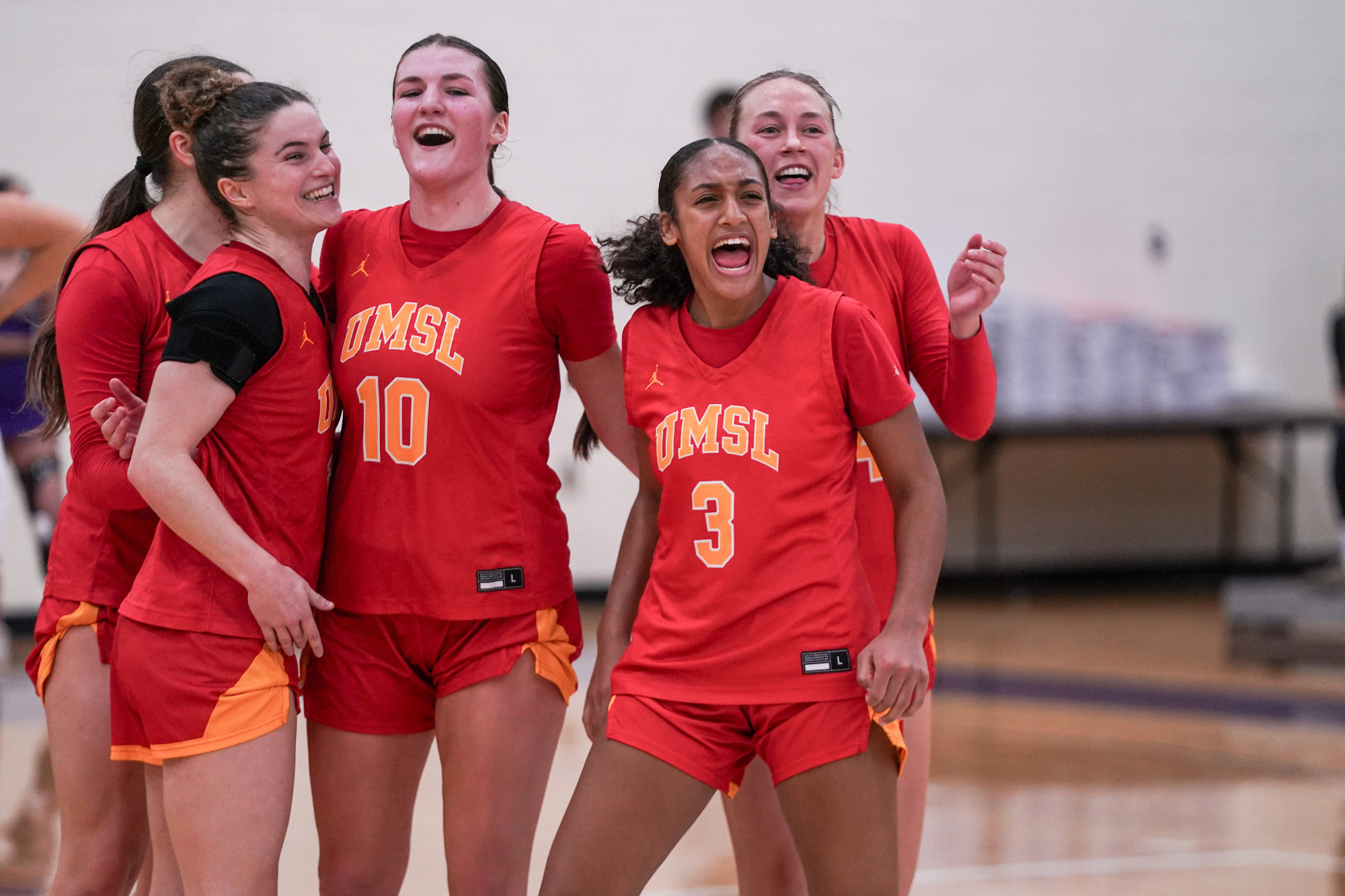 Jaeda Wilson, Morgan Ramthun, Anna Costa Riera and Jayden Kuper celebrate after UMSL's win at McKendree on January 29