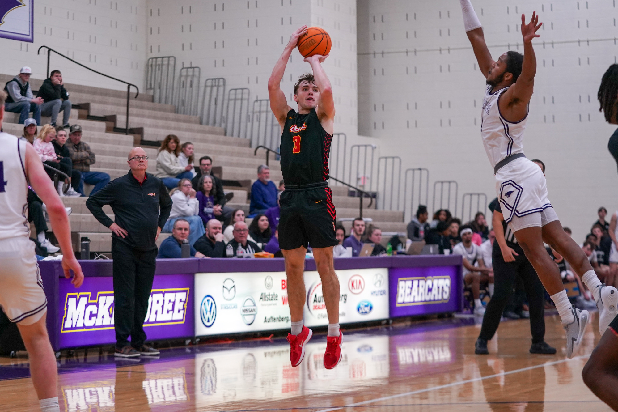 Jake Hamilton attempts a three-point shot over a McKendree in a game against the Bearcats on January 29.