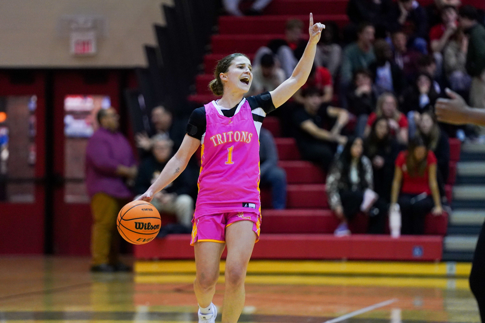 Anna Costa Riera calls out a play as she dribbles the ball up the floor in a game against the University of Indianapolis on Thursday (February 5).