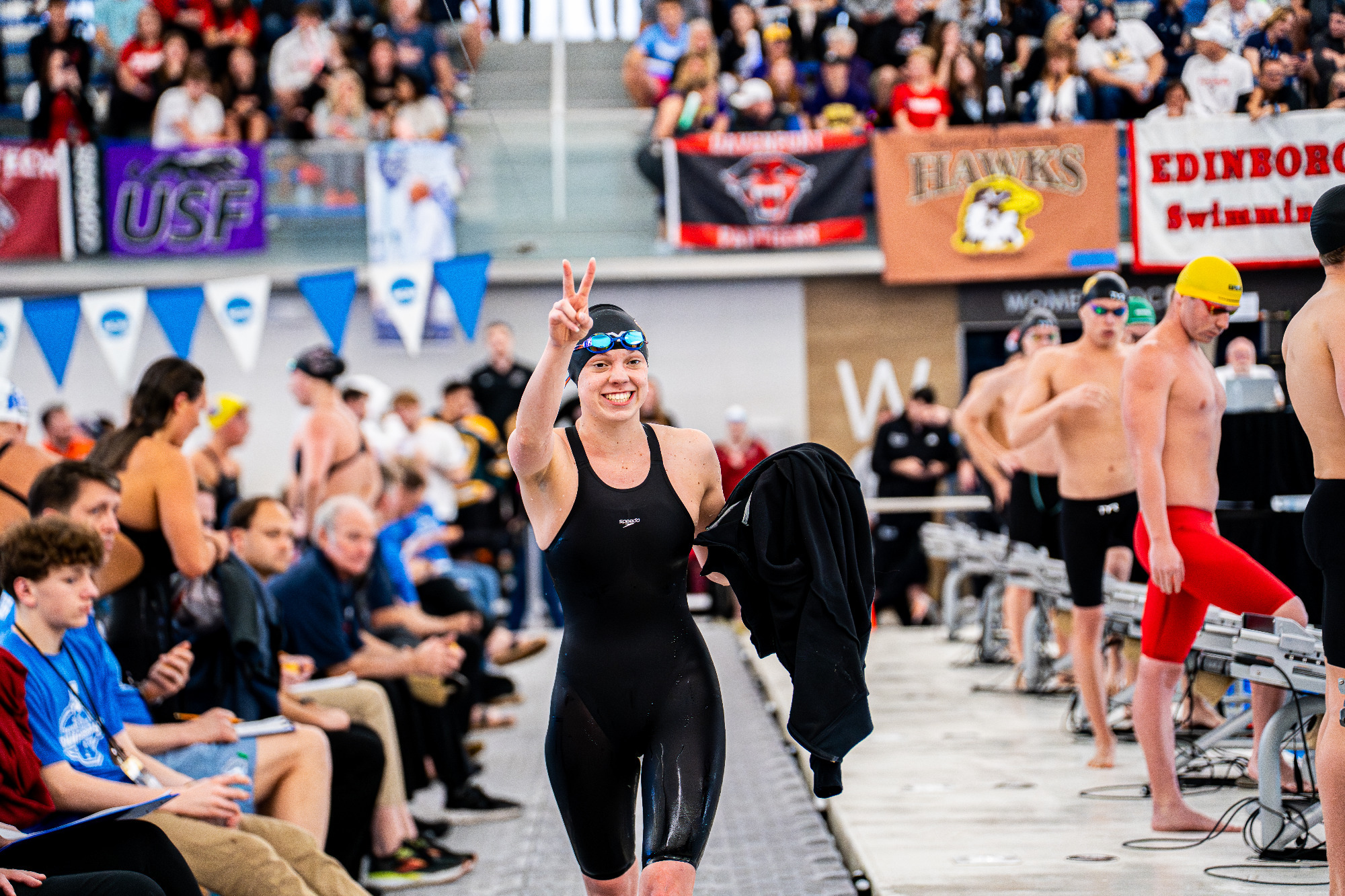 Justice Beard celebrates holding up two fingers after winning the 500 freestyle on Friday evening to capture her second national championship.