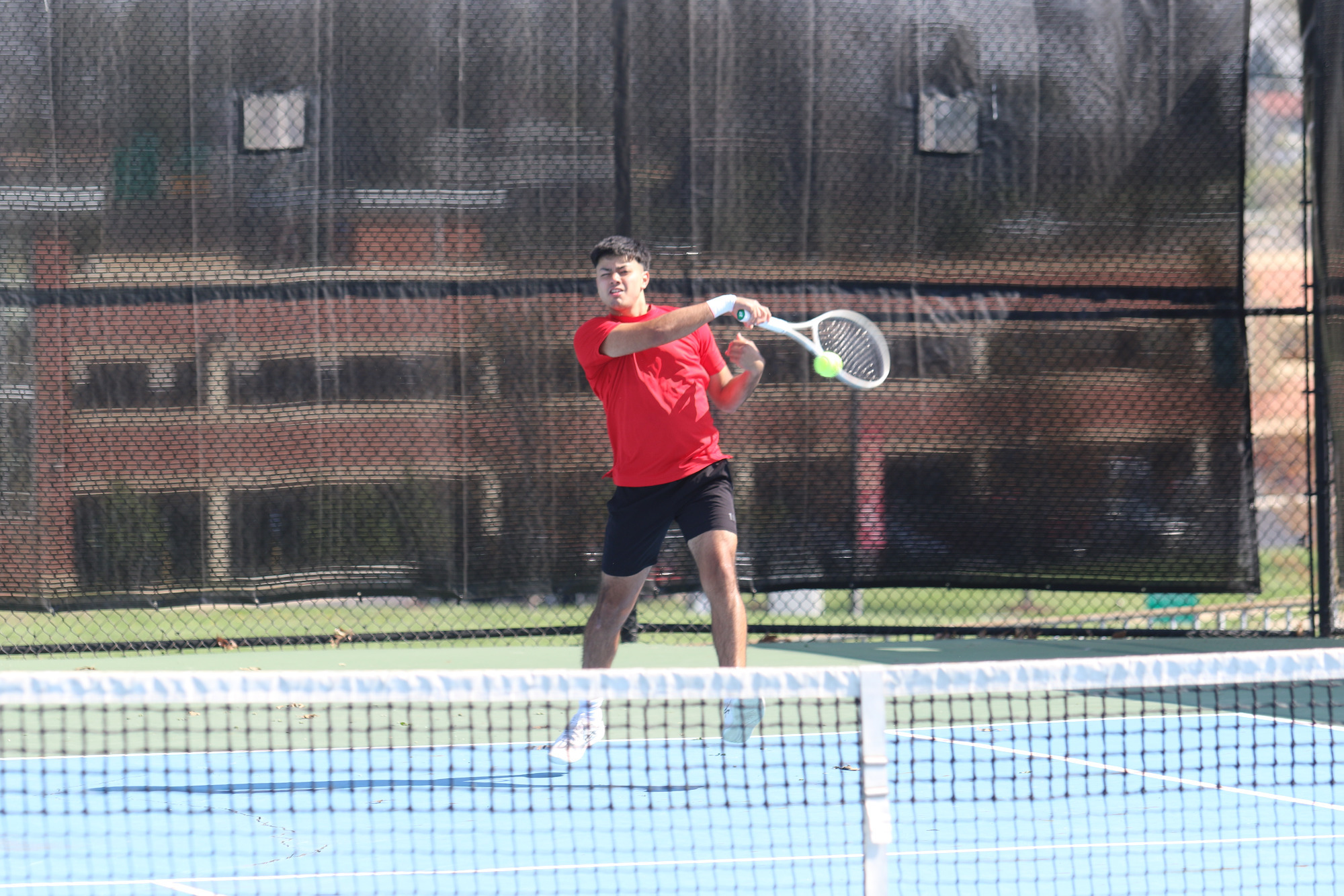 Jose Yanez returns a ball in a match against Quincy.