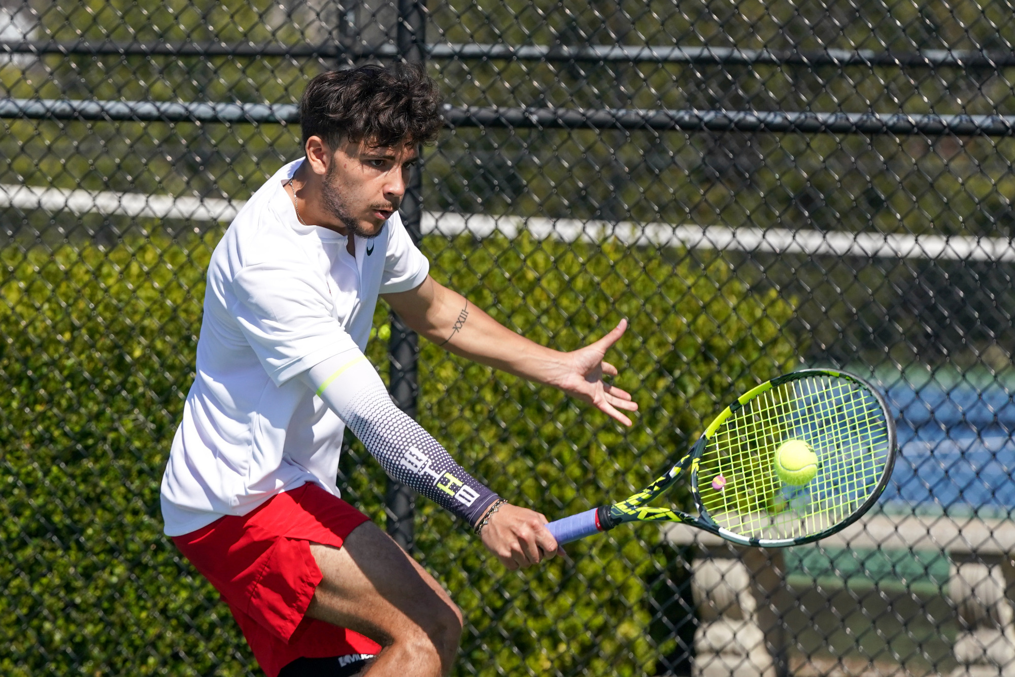 Andrea Ricart returns a backhand shot in a match against Northwest Missouri State.