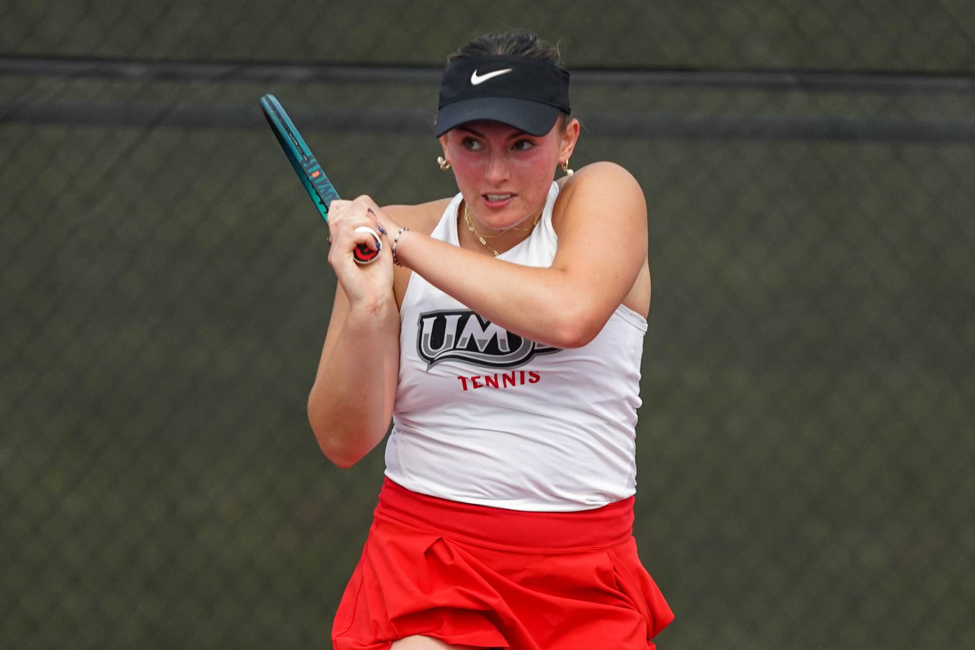 Morgan Lint hits a forehand shot in a match at the SIUE Cougar Invite last September
