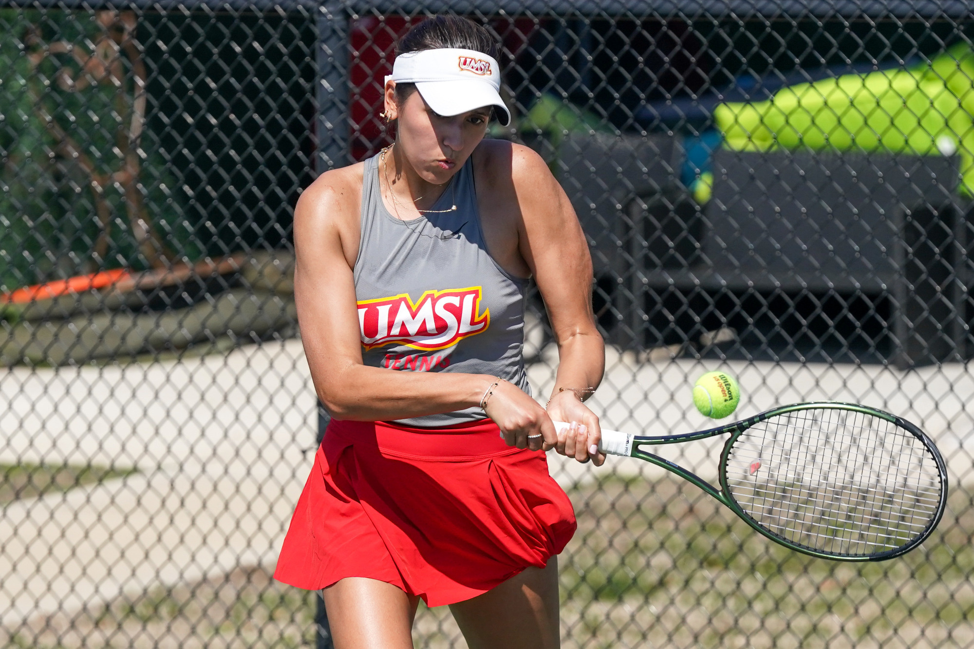 Aleksandra Lopez hits a backhand shot in a match against Northwest Missouri State