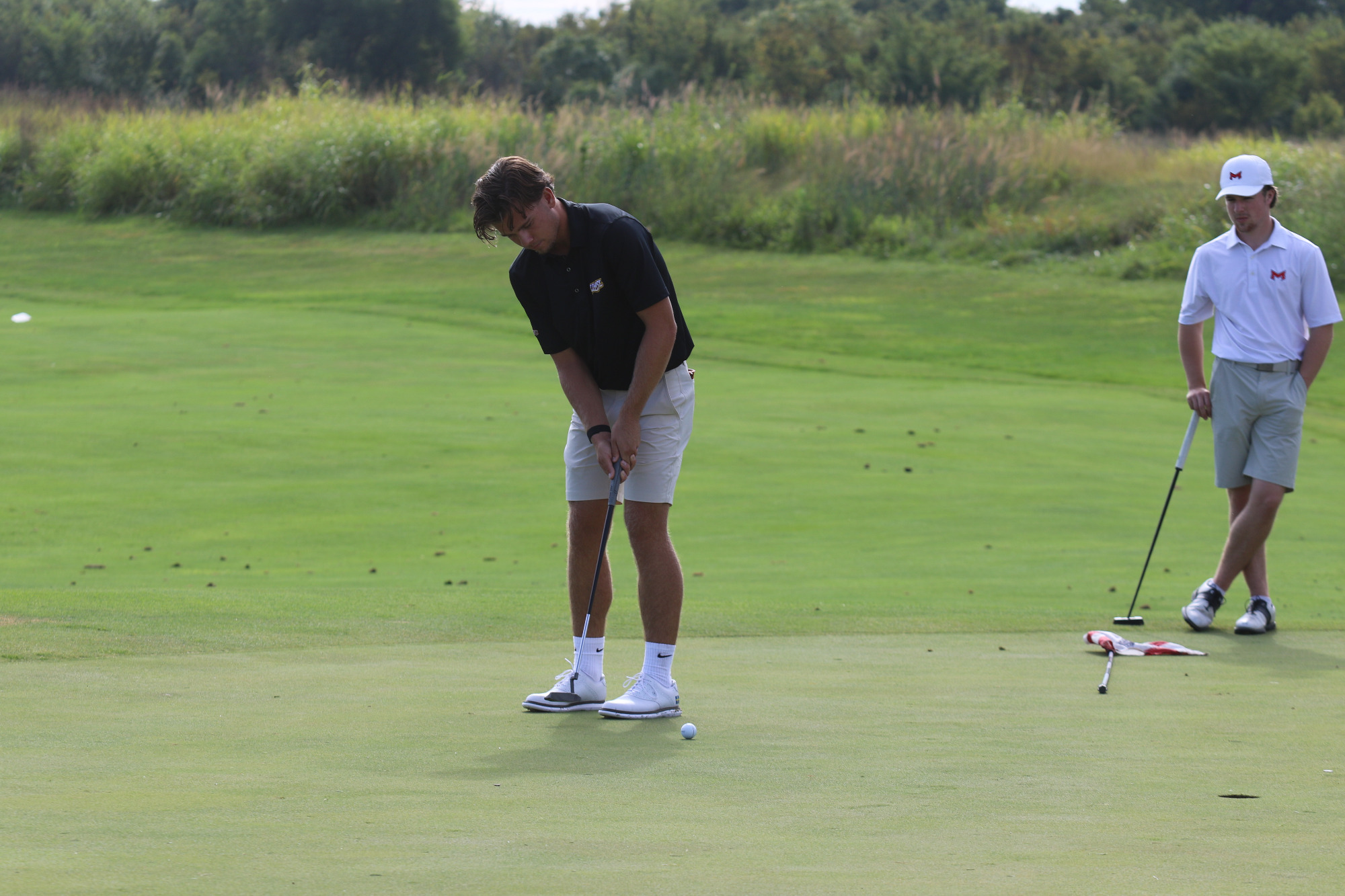 Ludvig Granlund attempting a putt during the first round of the 2025 Arch Cup