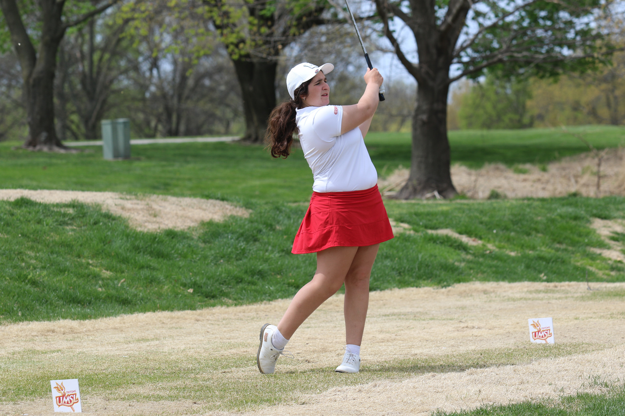 Mayan Covarrubias watches her drive off the 15th hole at Norwood Hills Country Club