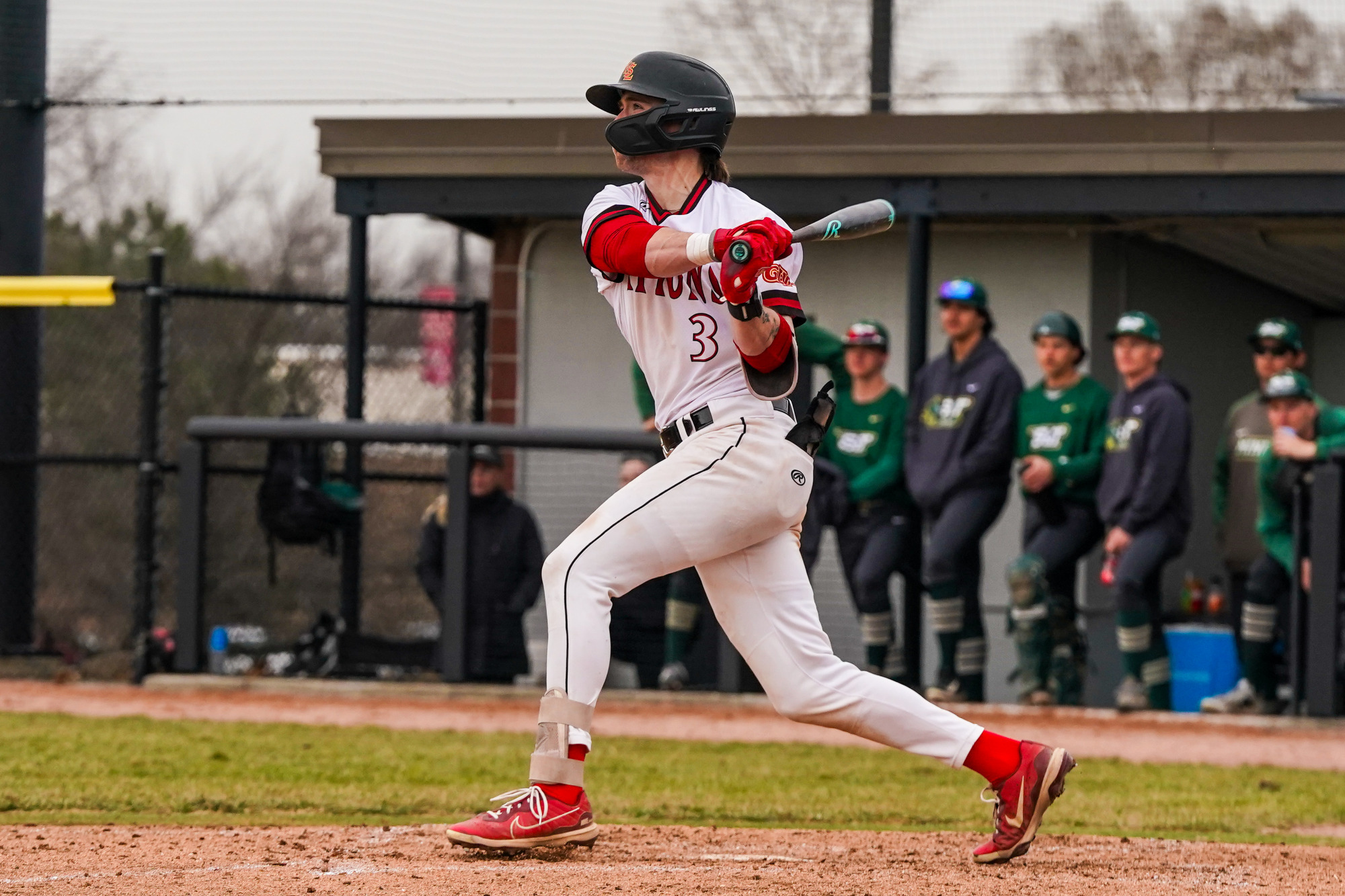 Mitch Bonczkowski follows through on his swing after hitting a baseball