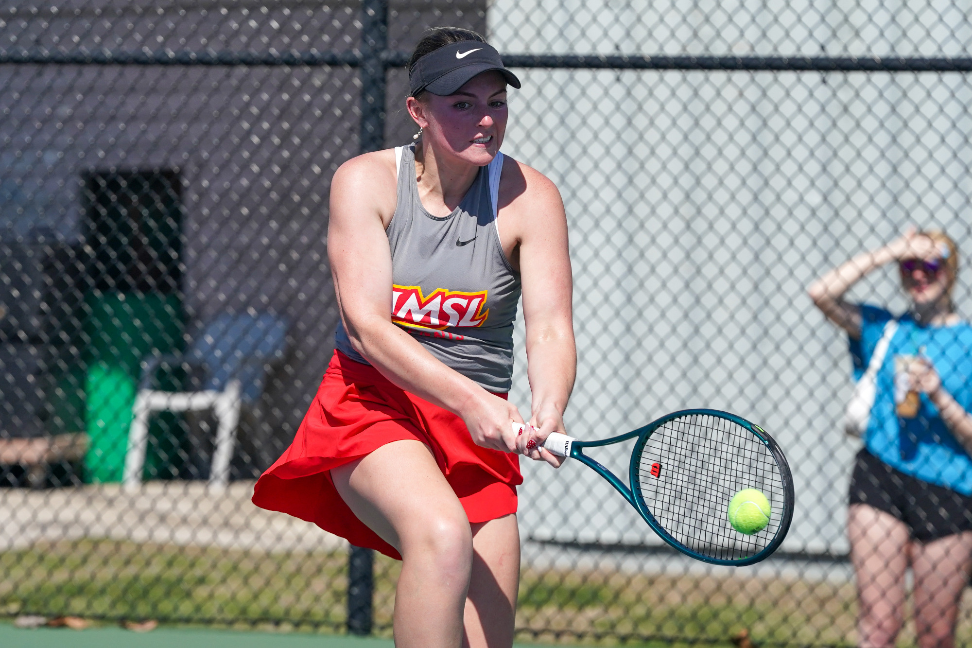 Morgan Lint hits a backhand shot in a match against Northwest Missouri State