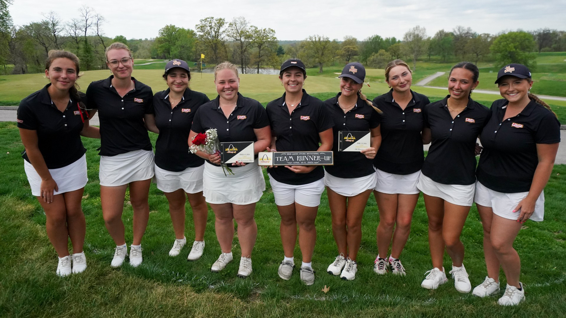 UMSL Women's Golf Team poses with their second place trophy on the 18th green at Norwood Hills Country Club after the UMSL Spring Invitational