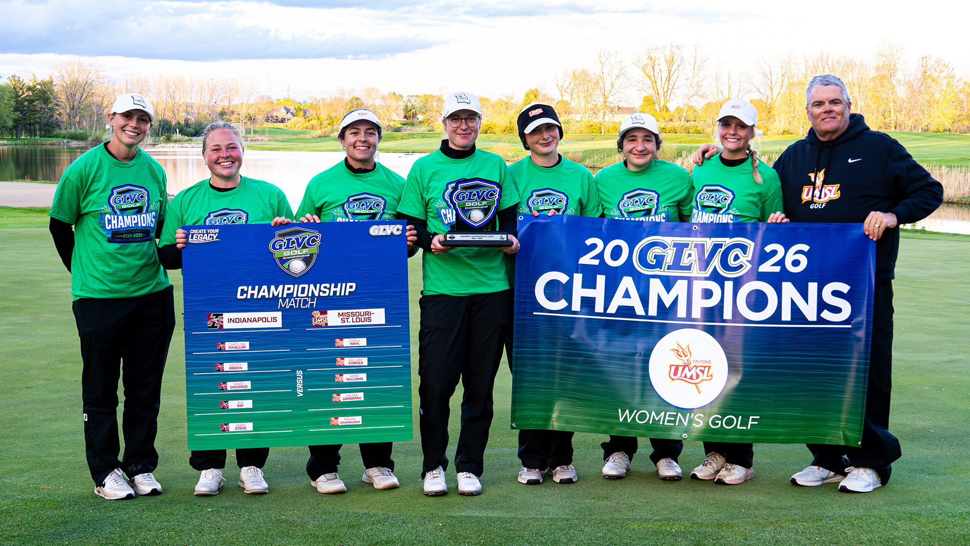 UMSL Women's Golf won the 2026 Great Lakes Valley Conference Championship on Sunday (April 19). The Players and Coaches are holding the championship match sign and GLVC Championship banner. Pictured L-R: Assistant Coach Kiley Cline, Wilma Zanderau, Alaina Ervin, Emmy Wahl, Hope Williams, Mayan Covarrubias, Hillary Currier and head coach Troy Halterman