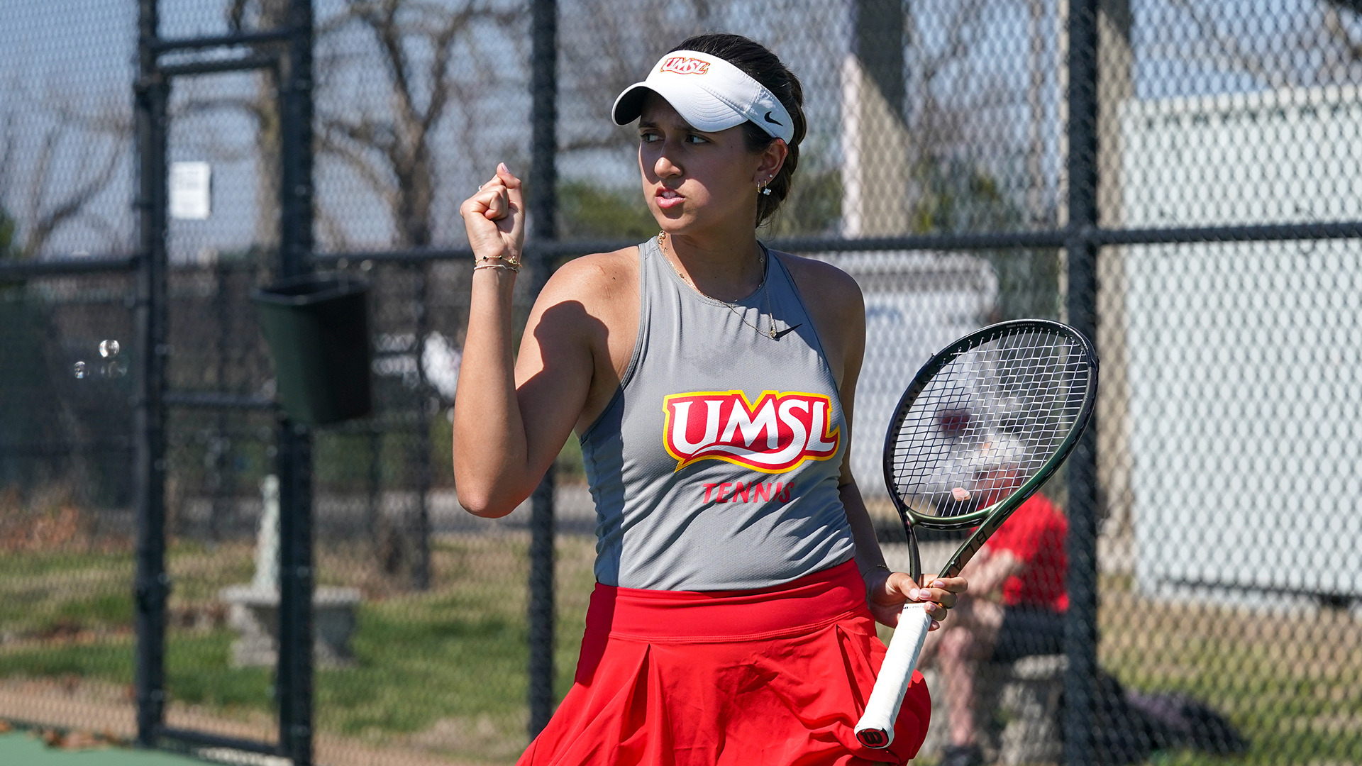 Aleksandra Lopez gives a fist pump after scoring a point