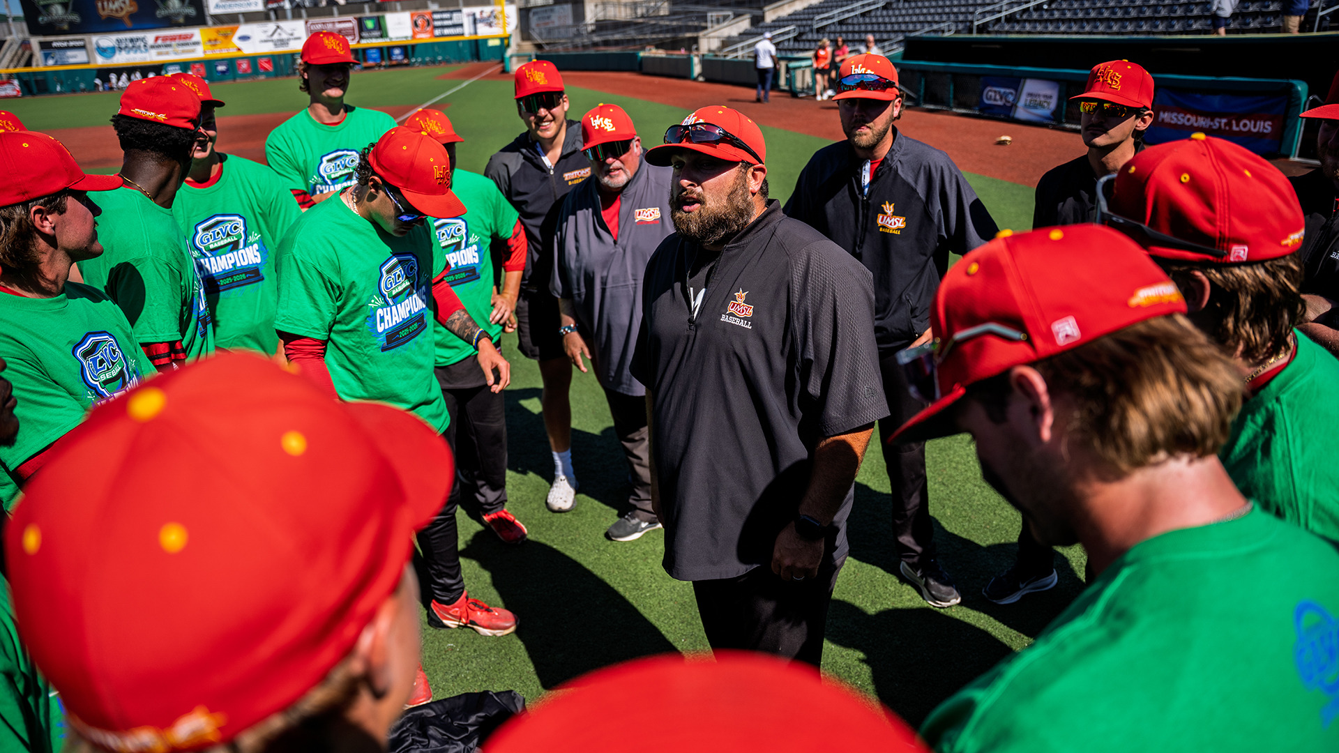 UMSL head baseball coach Scott Eul (center) addresses his team after the Tritons won the 2026 Great Lakes Valley Conference championship