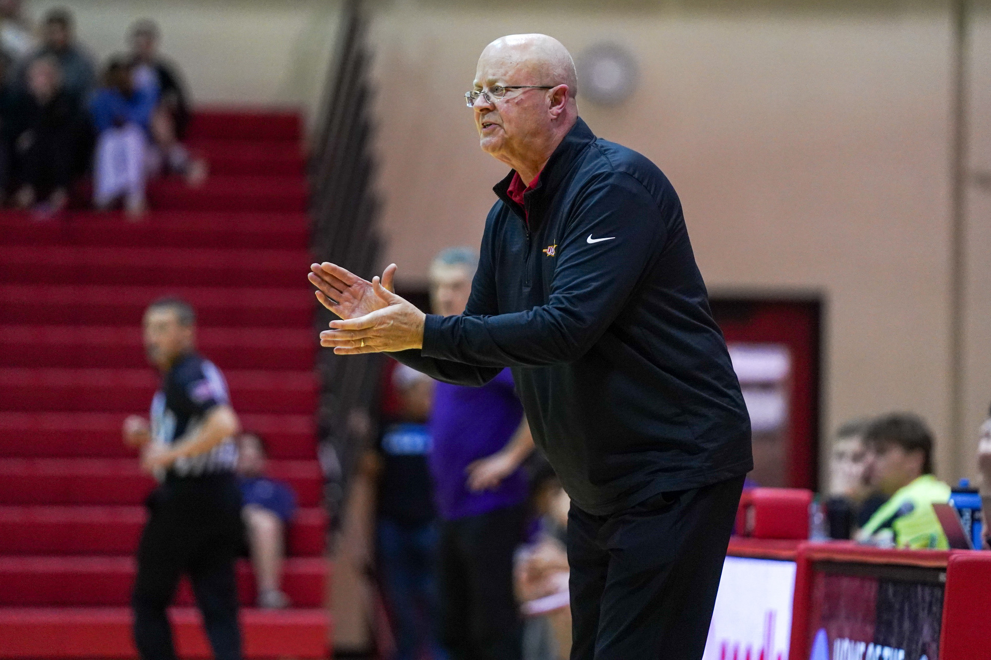 Bob Sundvold claps his hands encouraging his team from the sidelines in a game against Truman State