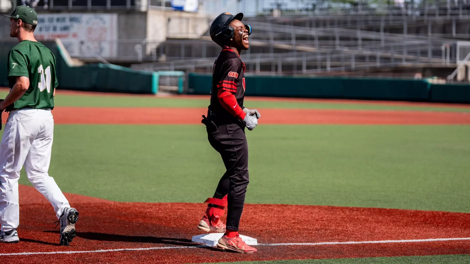 LJ Randle celebrates after hitting a triple against Missouri S&T