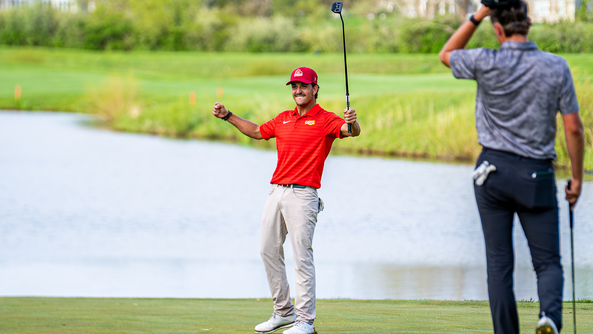 Dani Solavera celebrates after winning his match in the Great Lakes Valley Conference Men's Golf medal/match play final