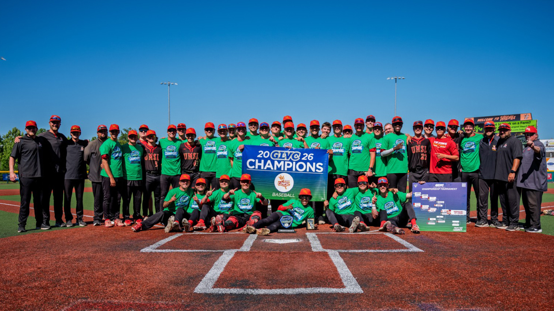 The UMSL Tritons celebrate their 2026 Great Lakes Valley Conference championship with a team photo on the field