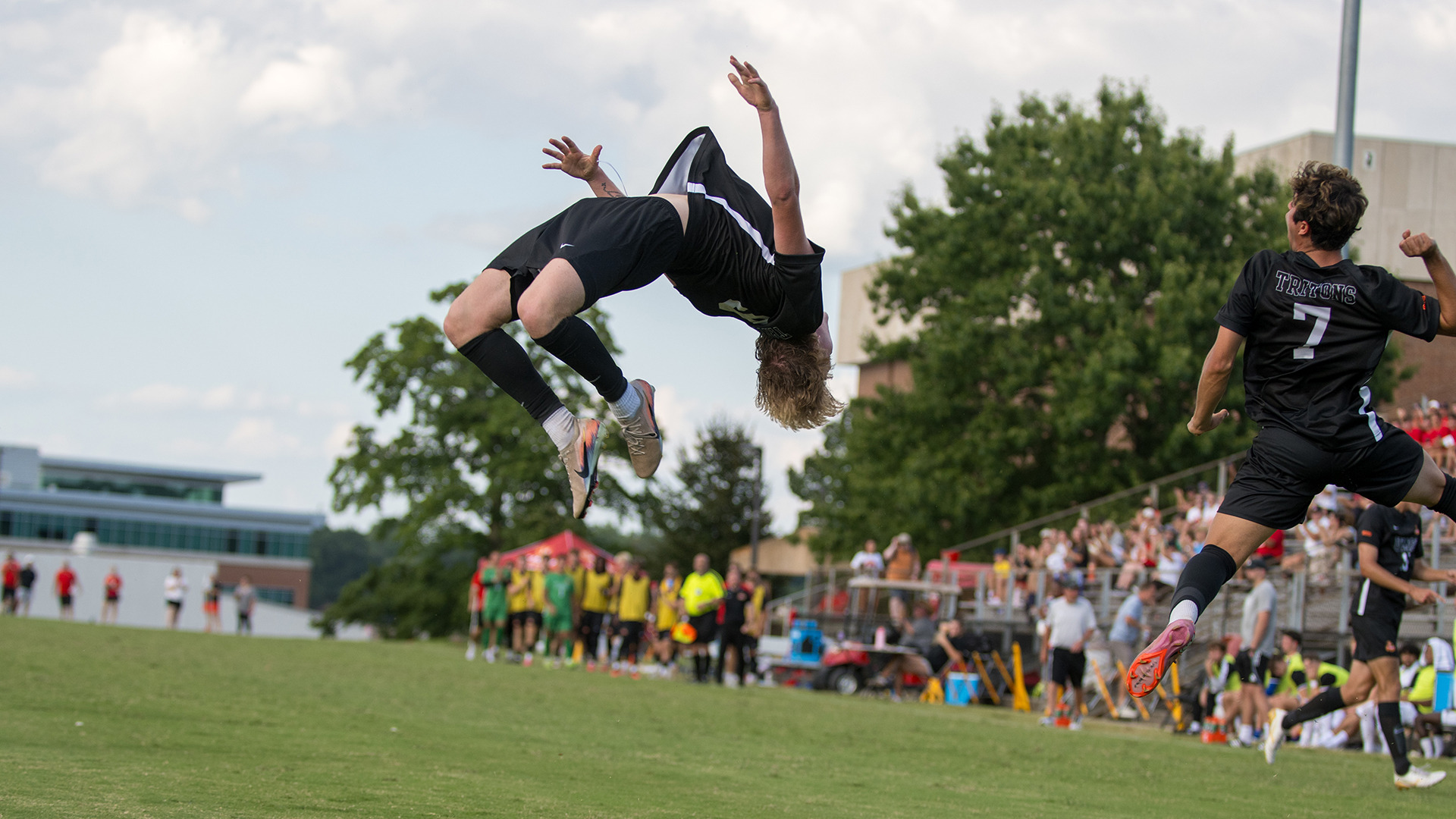 Brady Freeman does a flip while Benjamin Ocampo leaps in the air with a fist pump after Freeman scored the game-winning goal against Kentucky Wesleyan