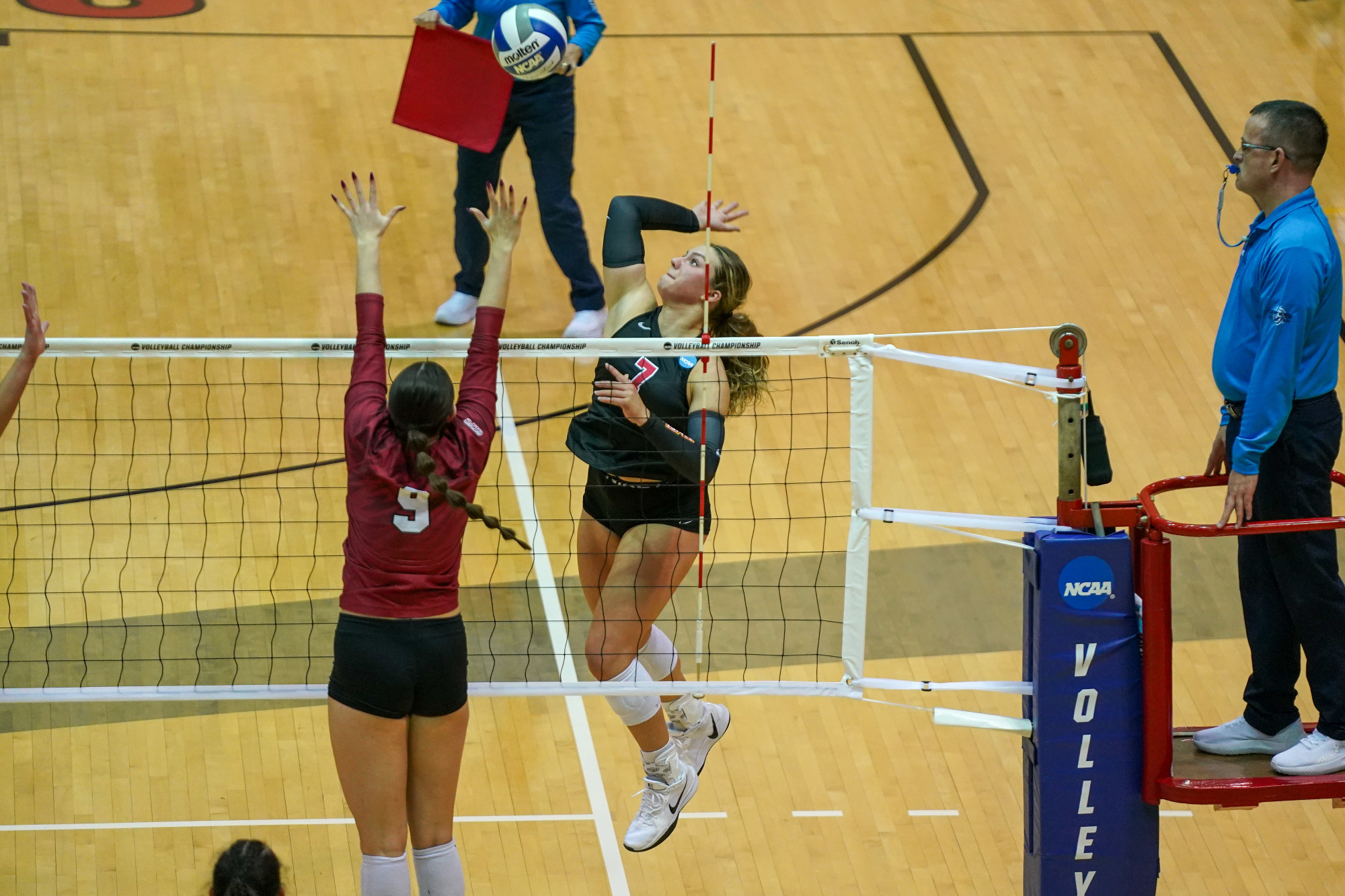 Bridget Cassady goes up for an attack attempt in an NCAA Volleyball match against the University of Indianapolis.