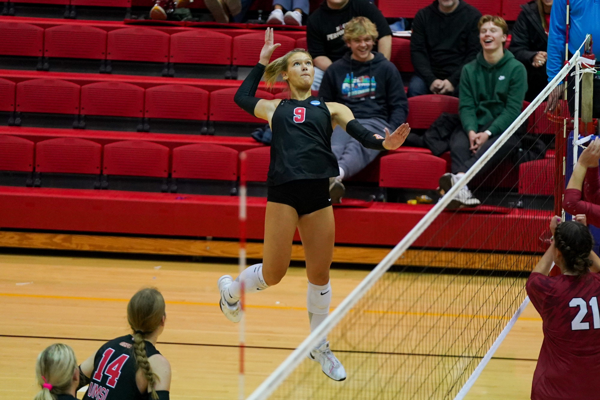 Maggie Johnson goes up for an attack in an NCAA volleyball match against the University of Indianapolis