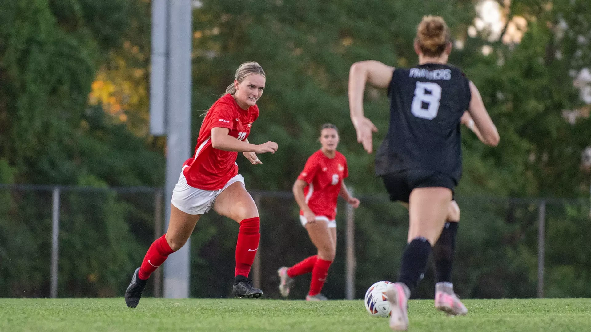 University of Missouri-St. Louis defender Taylor Martin (#19) battles Drury's Mia Smith (#8) for possession of a loose ball in an NCAA women's soccer contest.