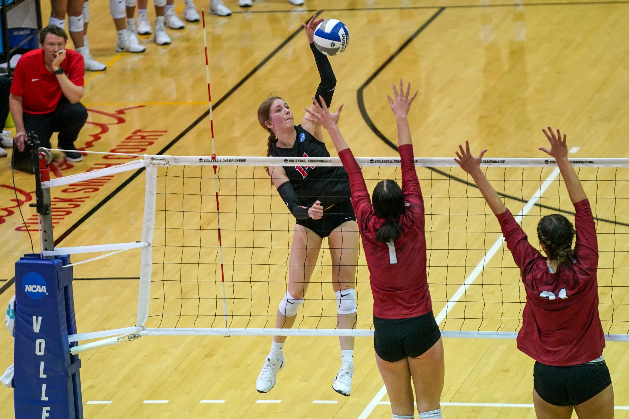 Alayna Santel goes up for an attack attempt in an NCAA Division II women's volleyball match against the University of Indianapolis.